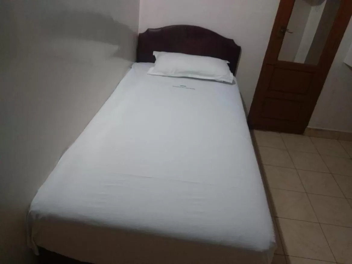 Bed in Anandan Tourist Home