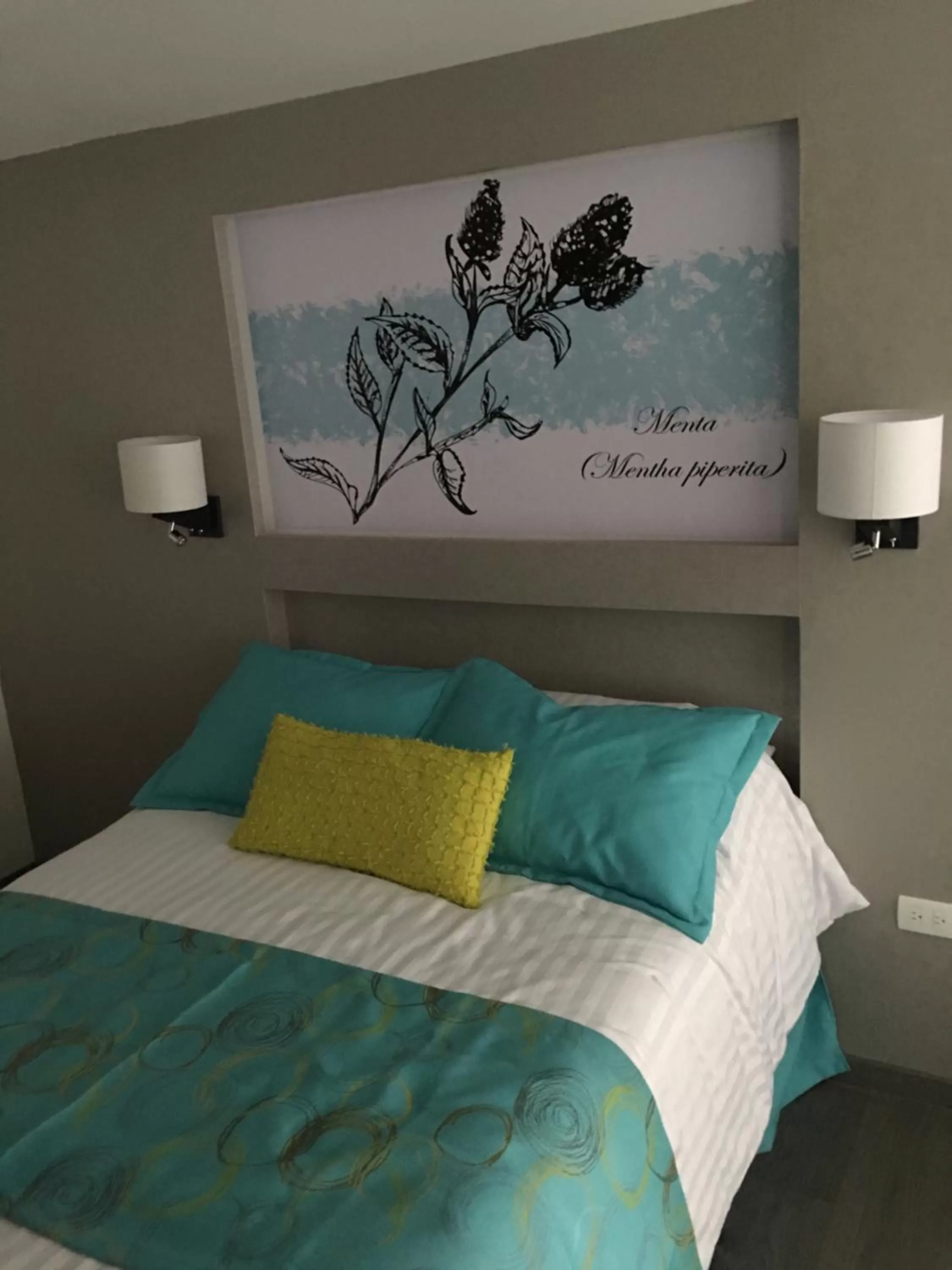 Bed in Herbal Inn Suites