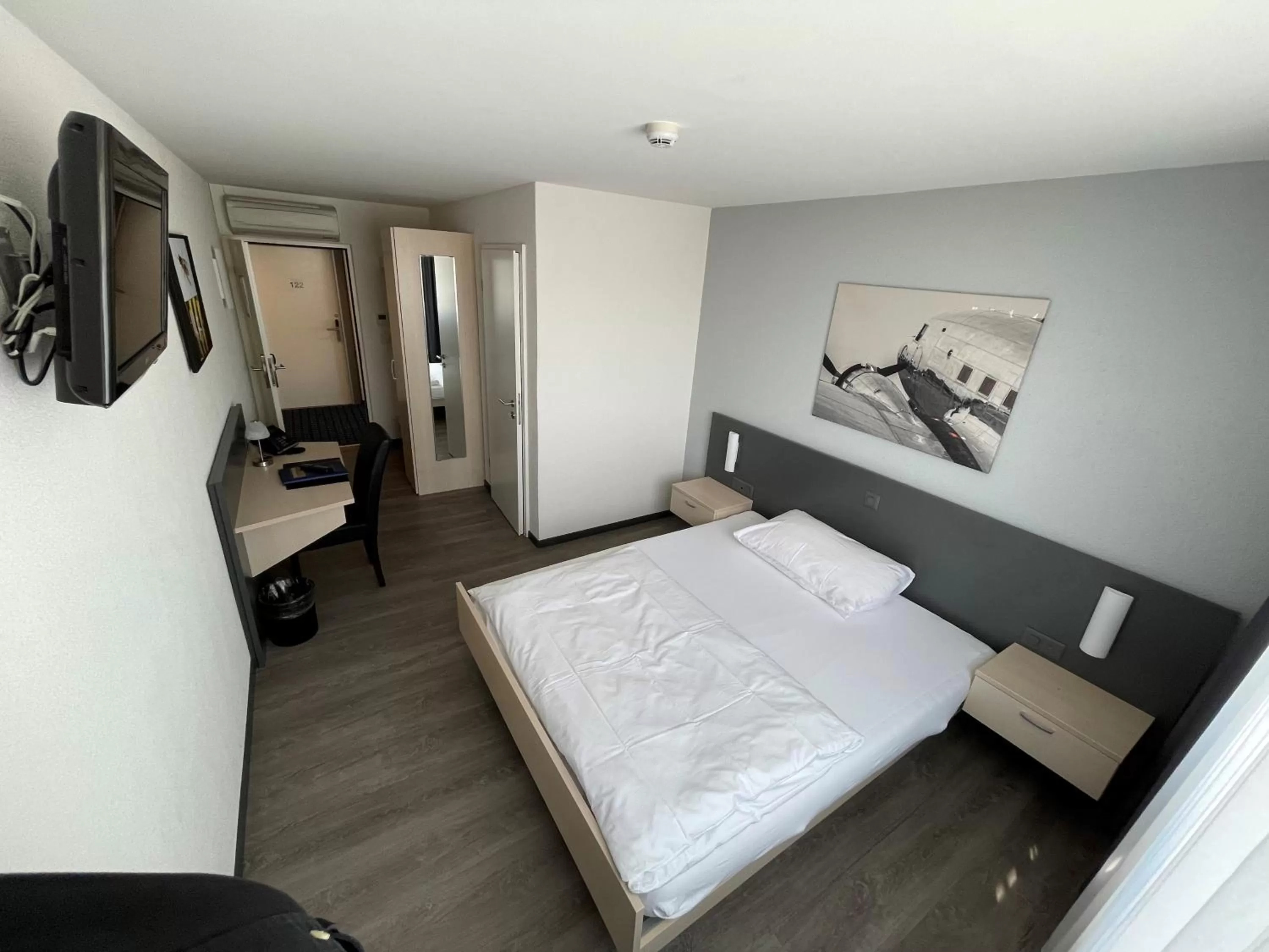 Photo of the whole room, Bed in Airporthotel Grenchen