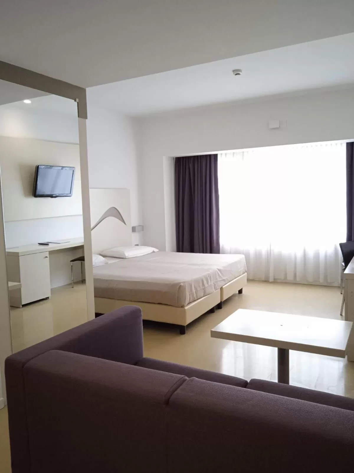 Seating area, Bed in Hotel Poseidon