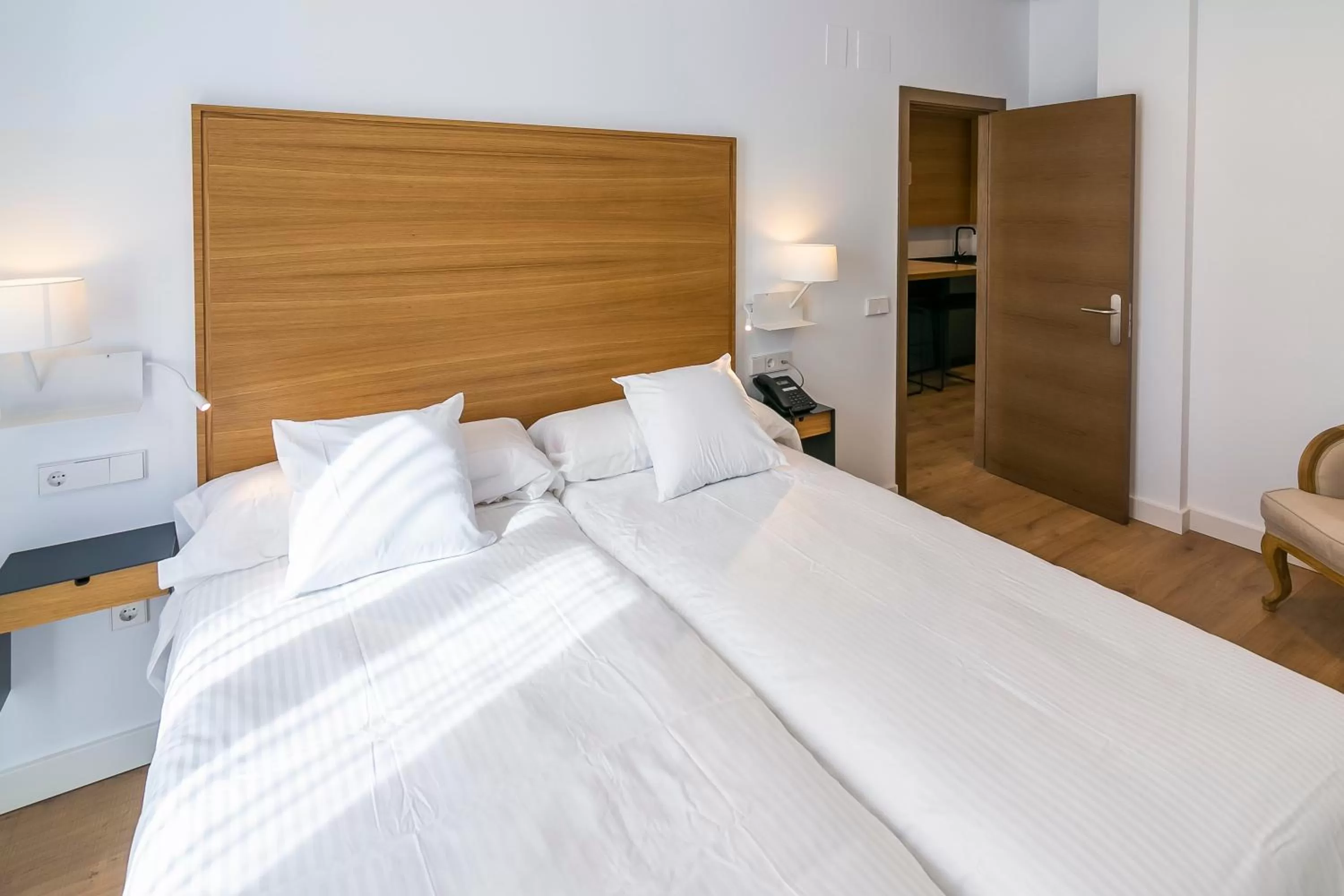 Bed in Aquitania Home Suites