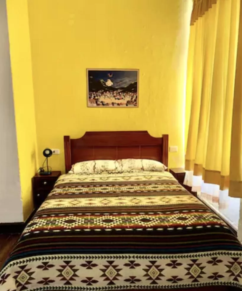 Bed in Blue Door Housing Historic Quito