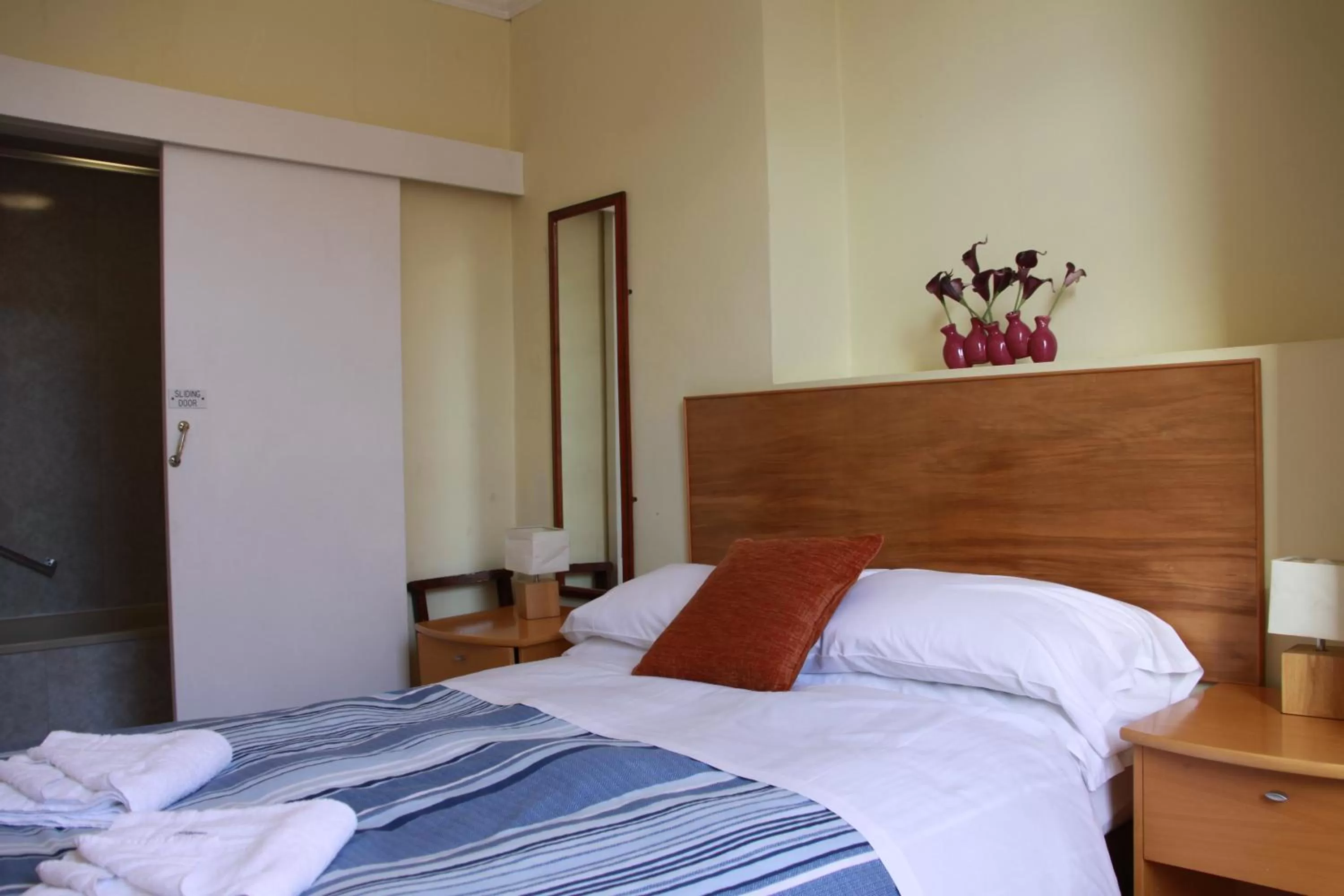 Bed in Ambassador Hotel