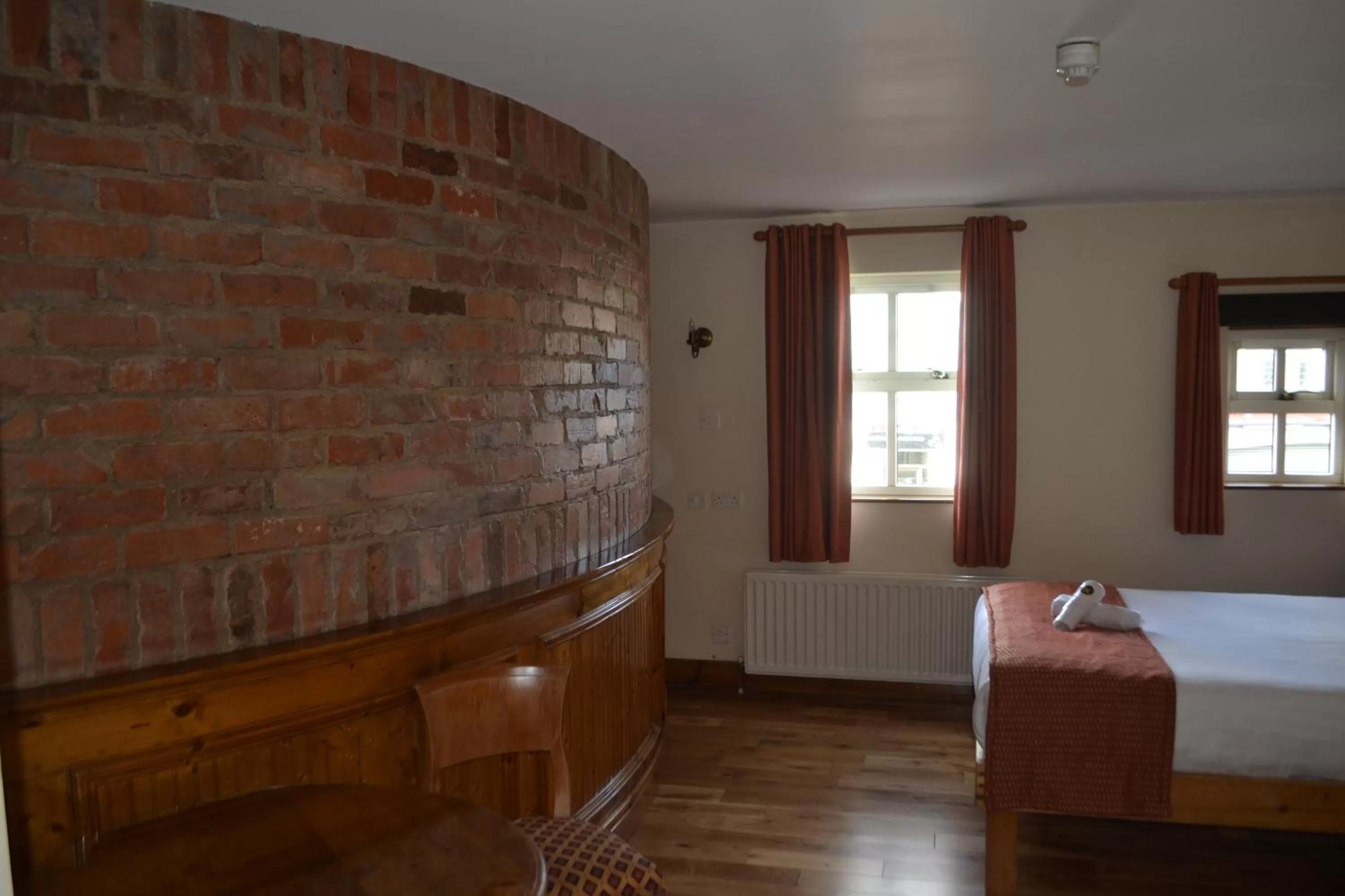 Bed in Walsh's Hotel and Apartments