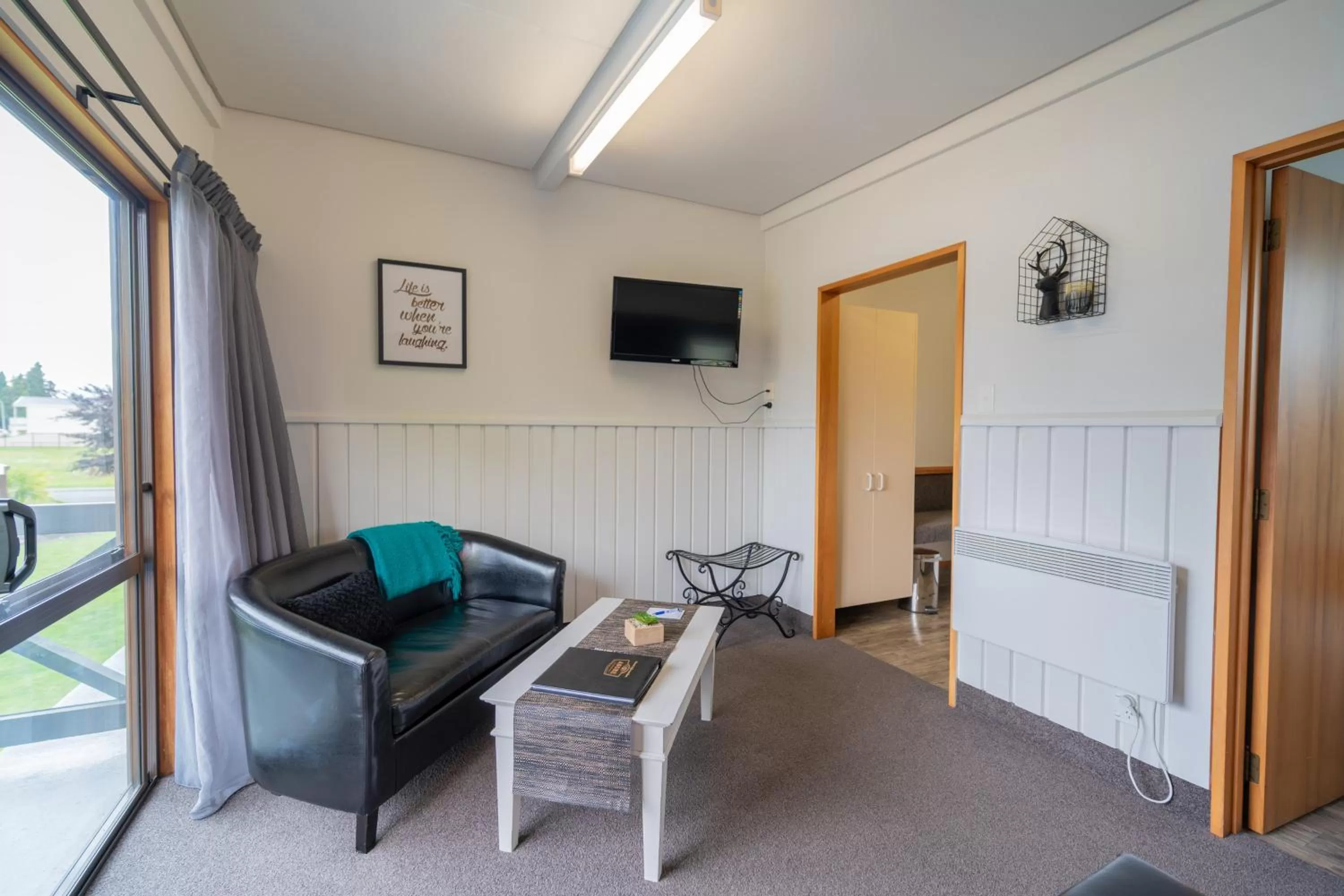 Seating area, Bed in ASURE Explorer Motel & Apartments