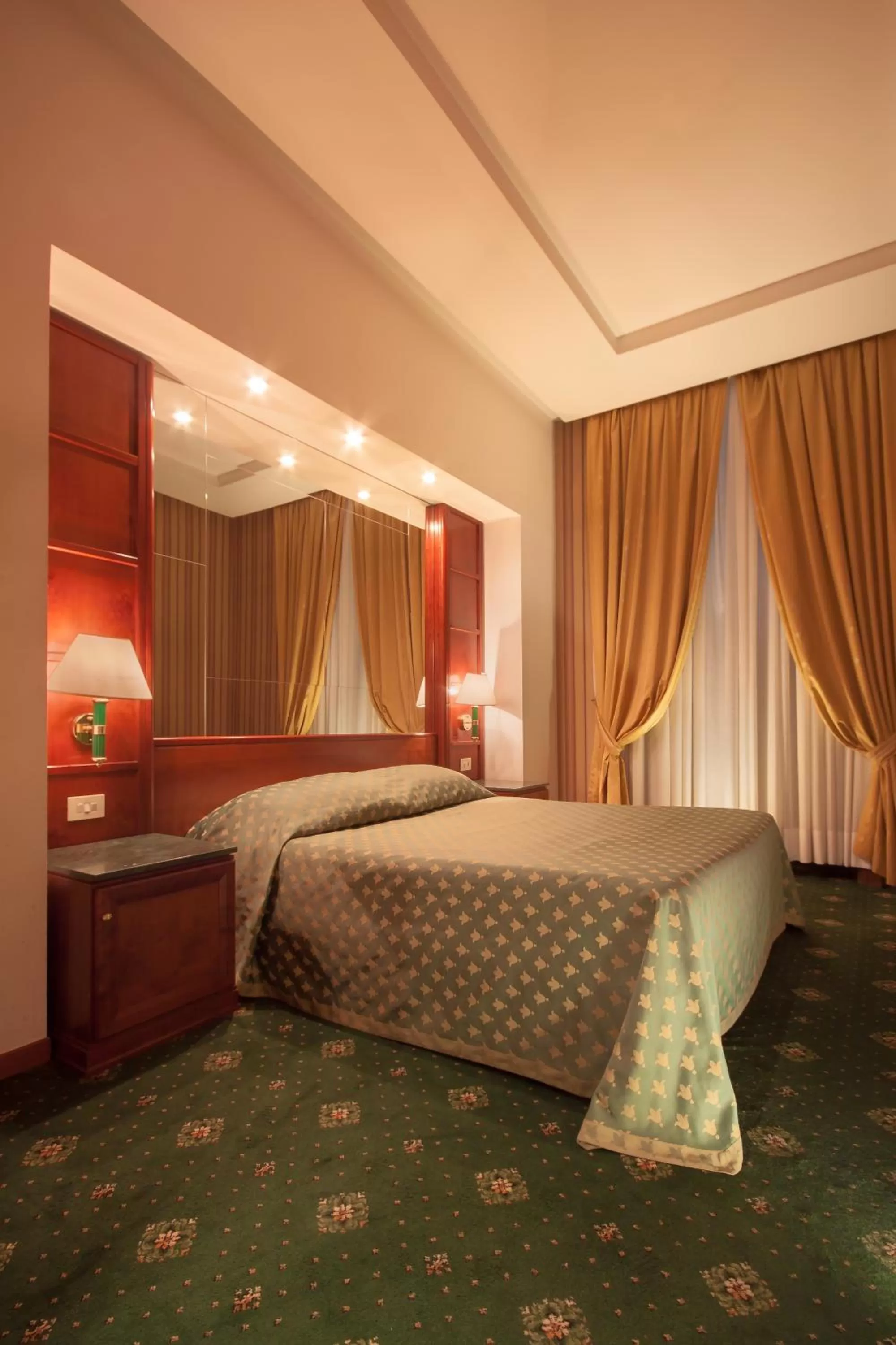 Bed in Atlante Garden Hotel