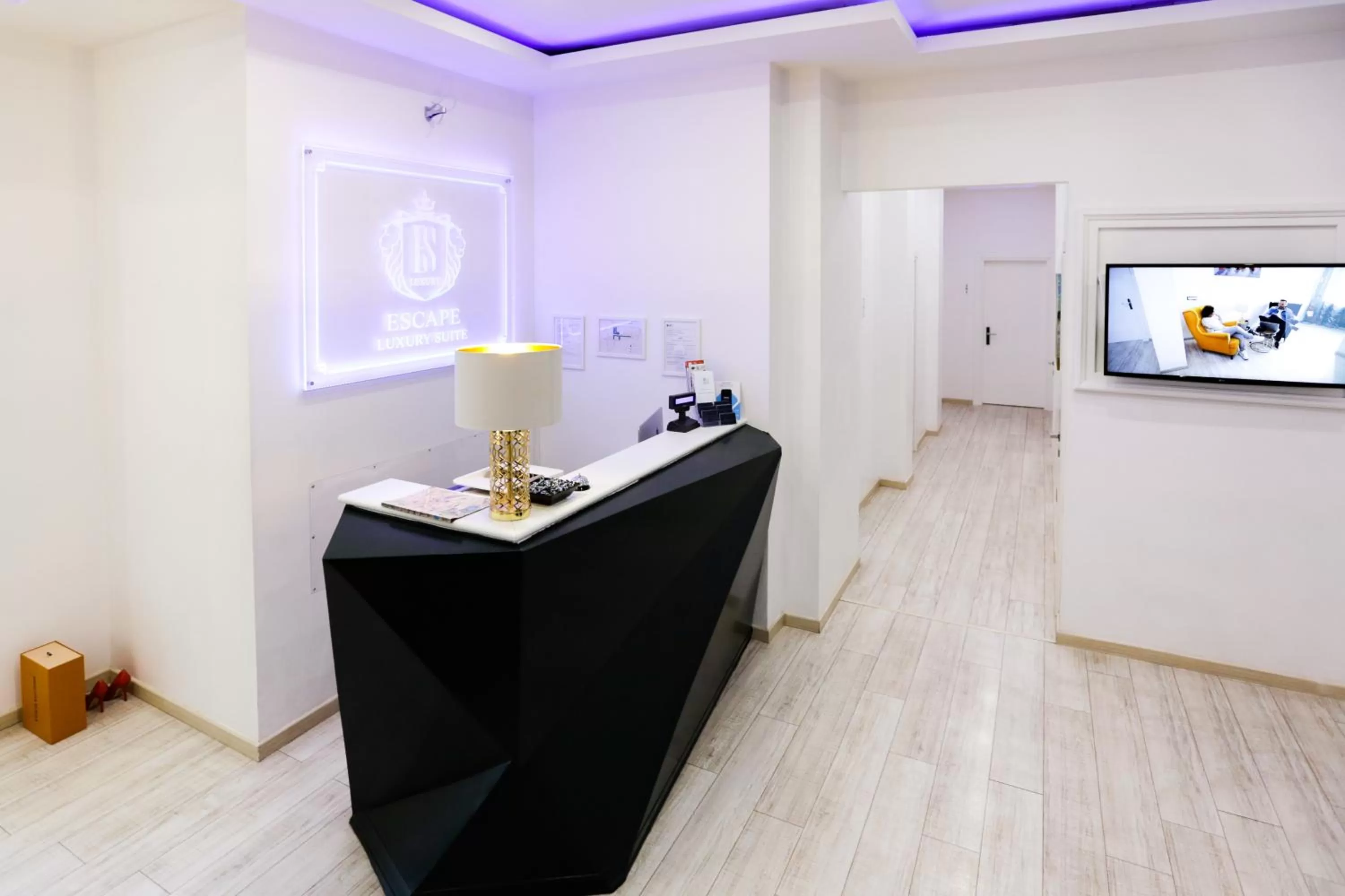 Communal lounge/ TV room in Escape Luxury Suite - CA Domus Collection