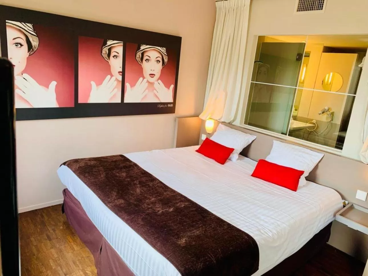 Bed in Standing Hotel Suites by Actisource