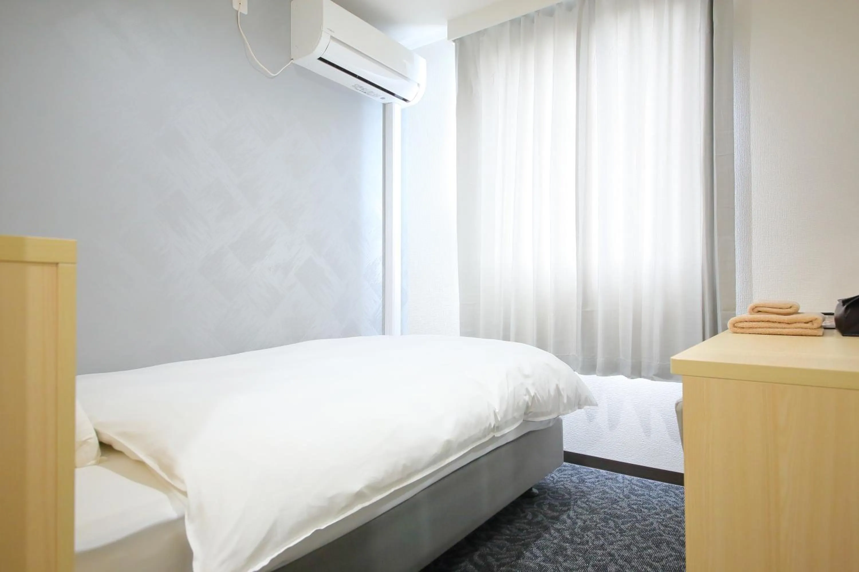 Bed in Hotel Shin-Imamiya