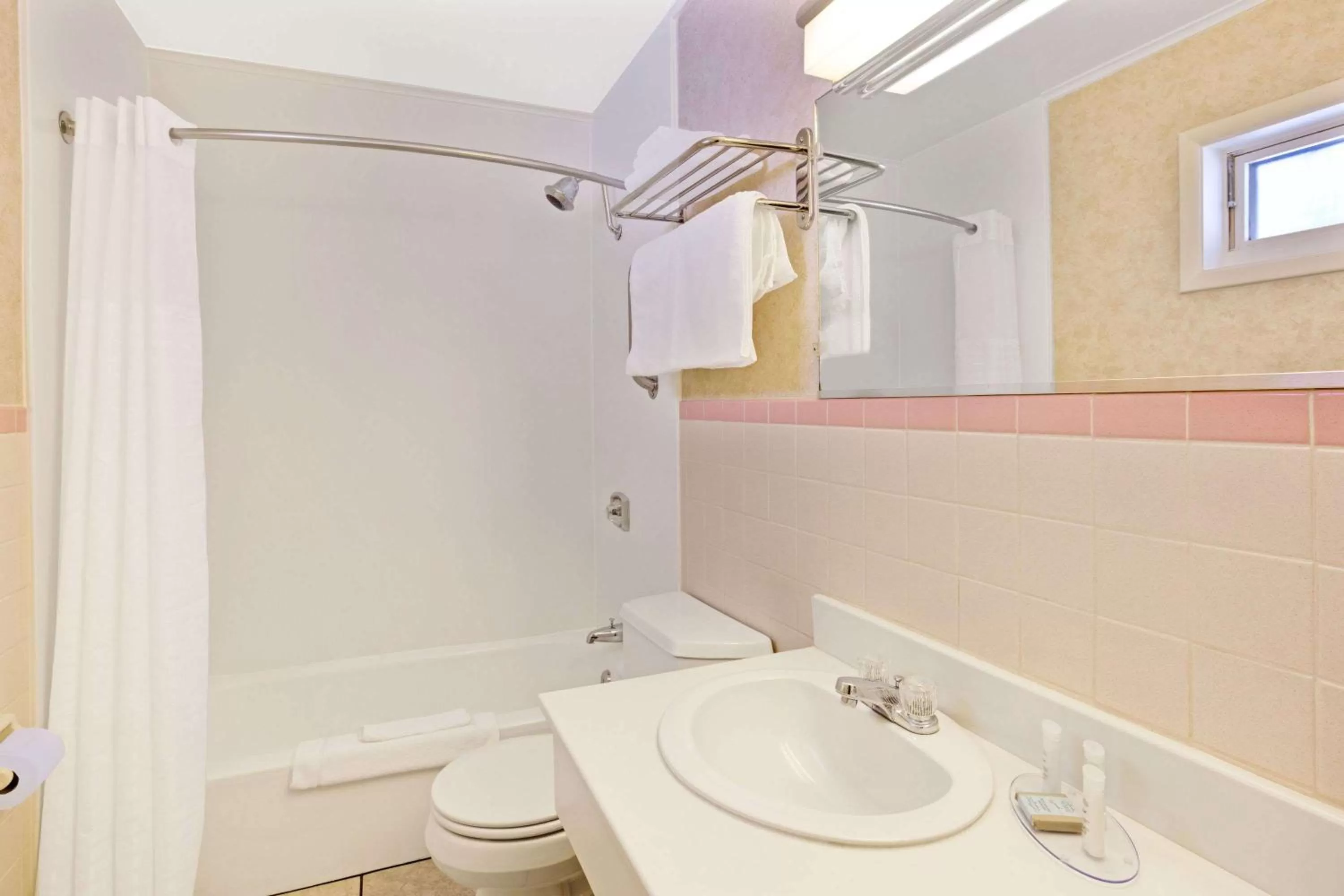 Bathroom in Travelodge by Wyndham Rapid City