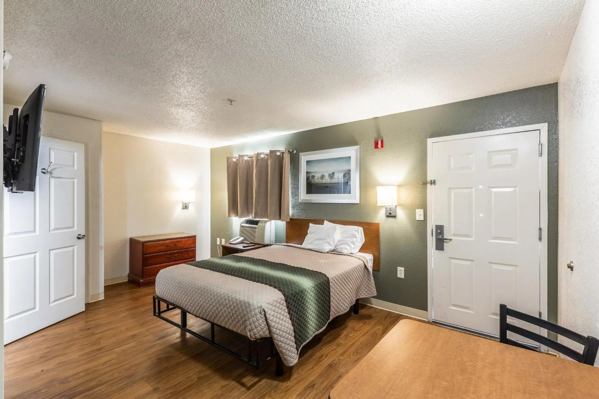 Photo of the whole room, Bed in HomeTowne Studios by Red Roof Gainesville, GA