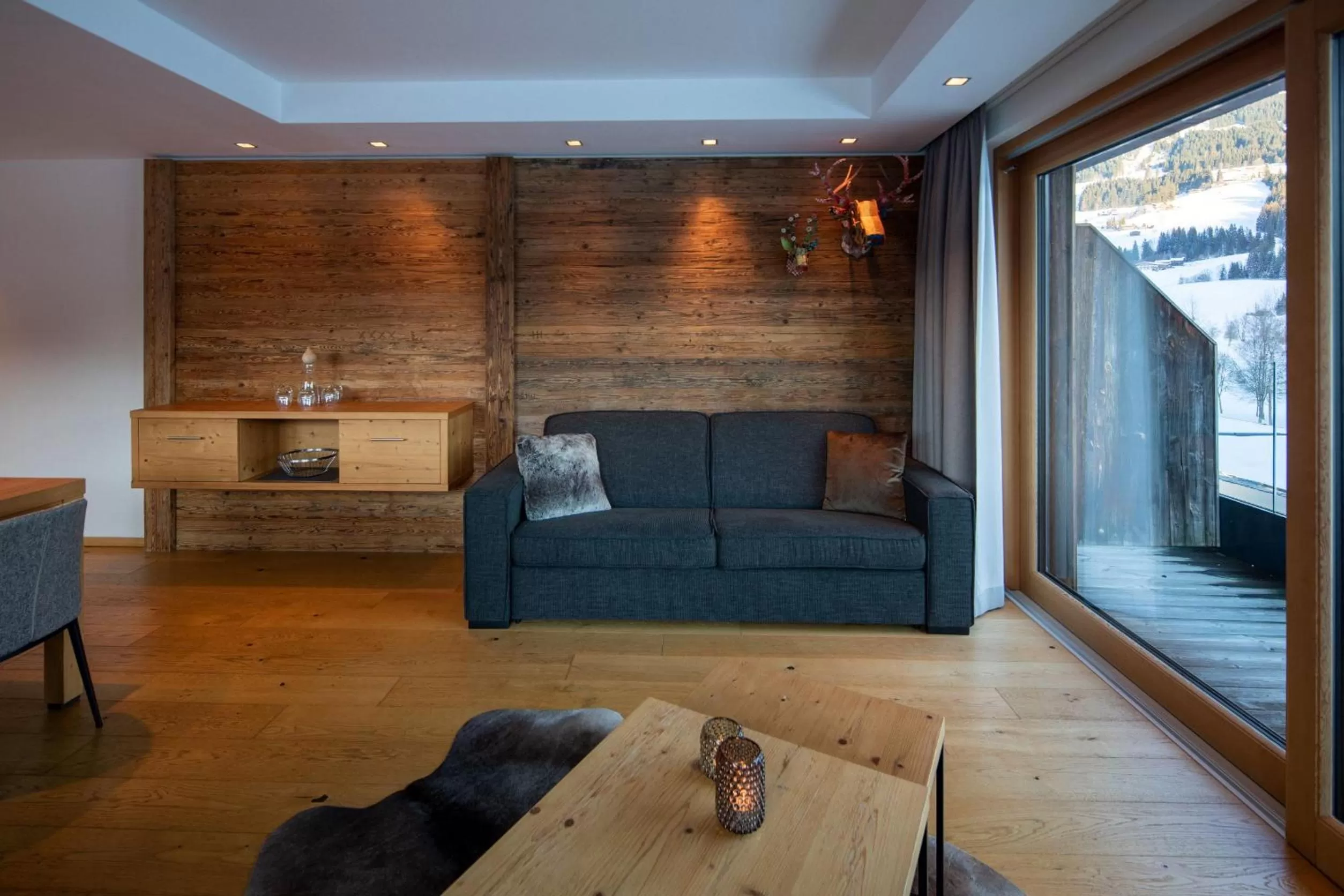 Living room in Berg & Golf Resort Westendorf by ALPS RESORTS