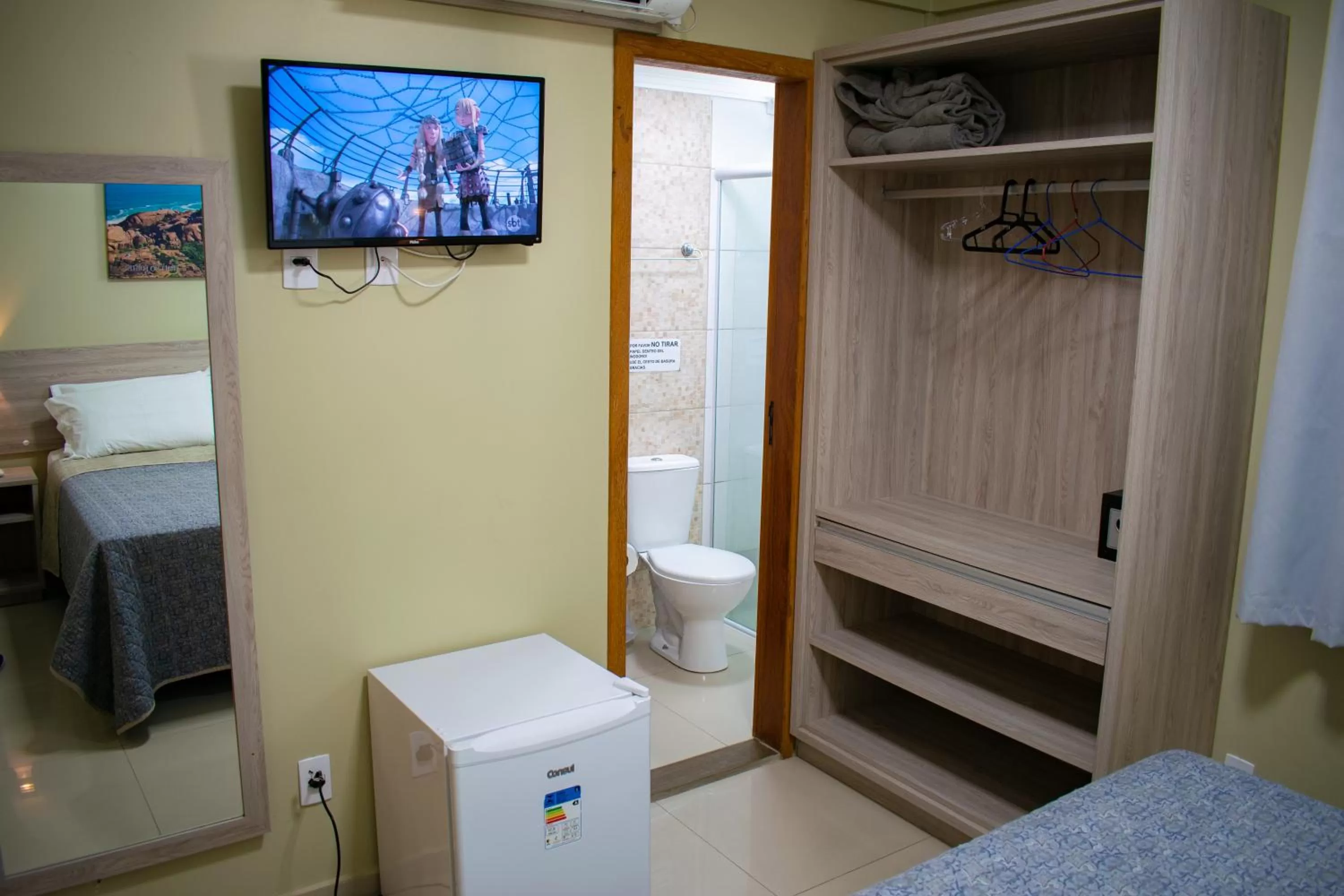 Bed in Pousada Tissiano