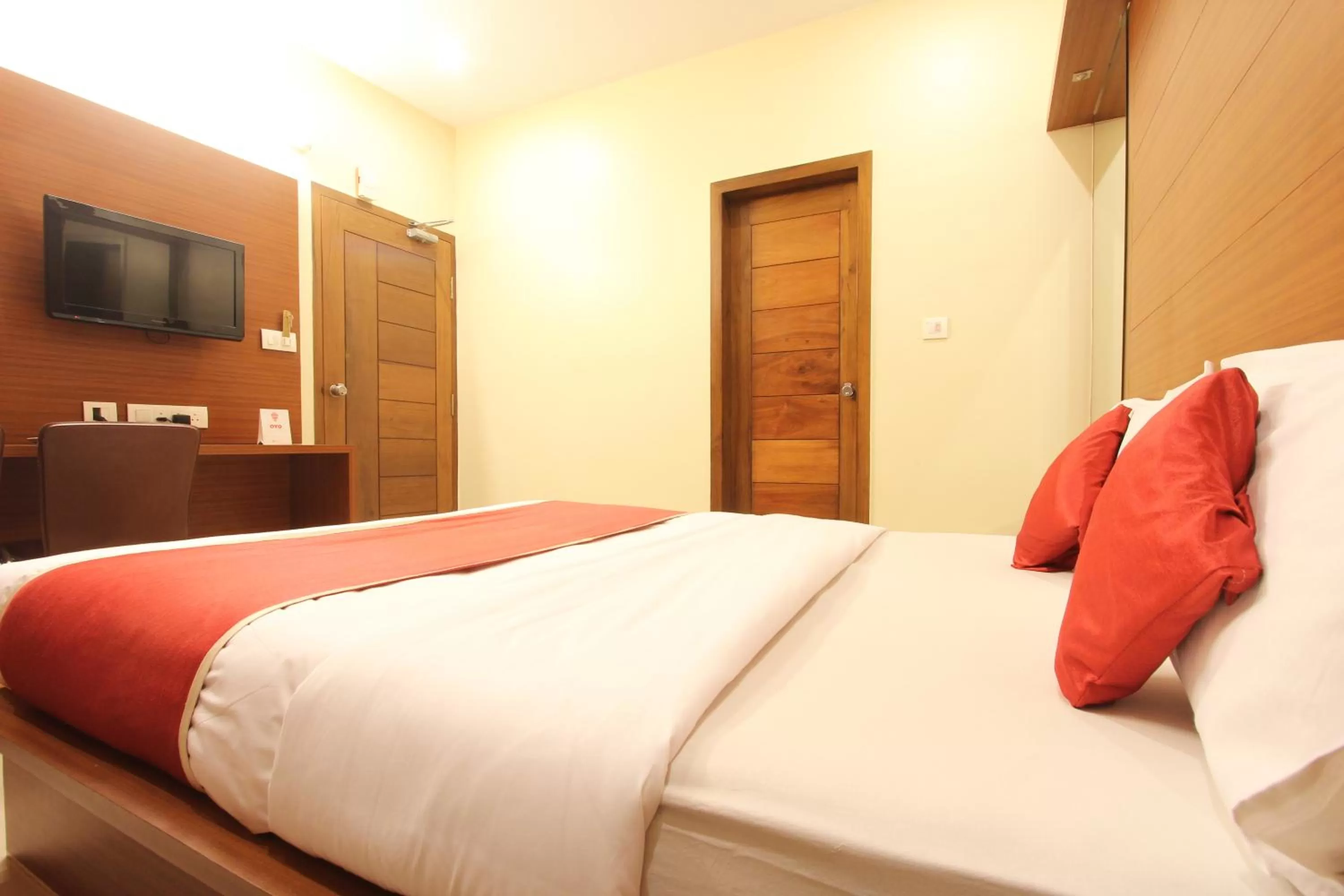 Bed in The Grand Inn Mysore