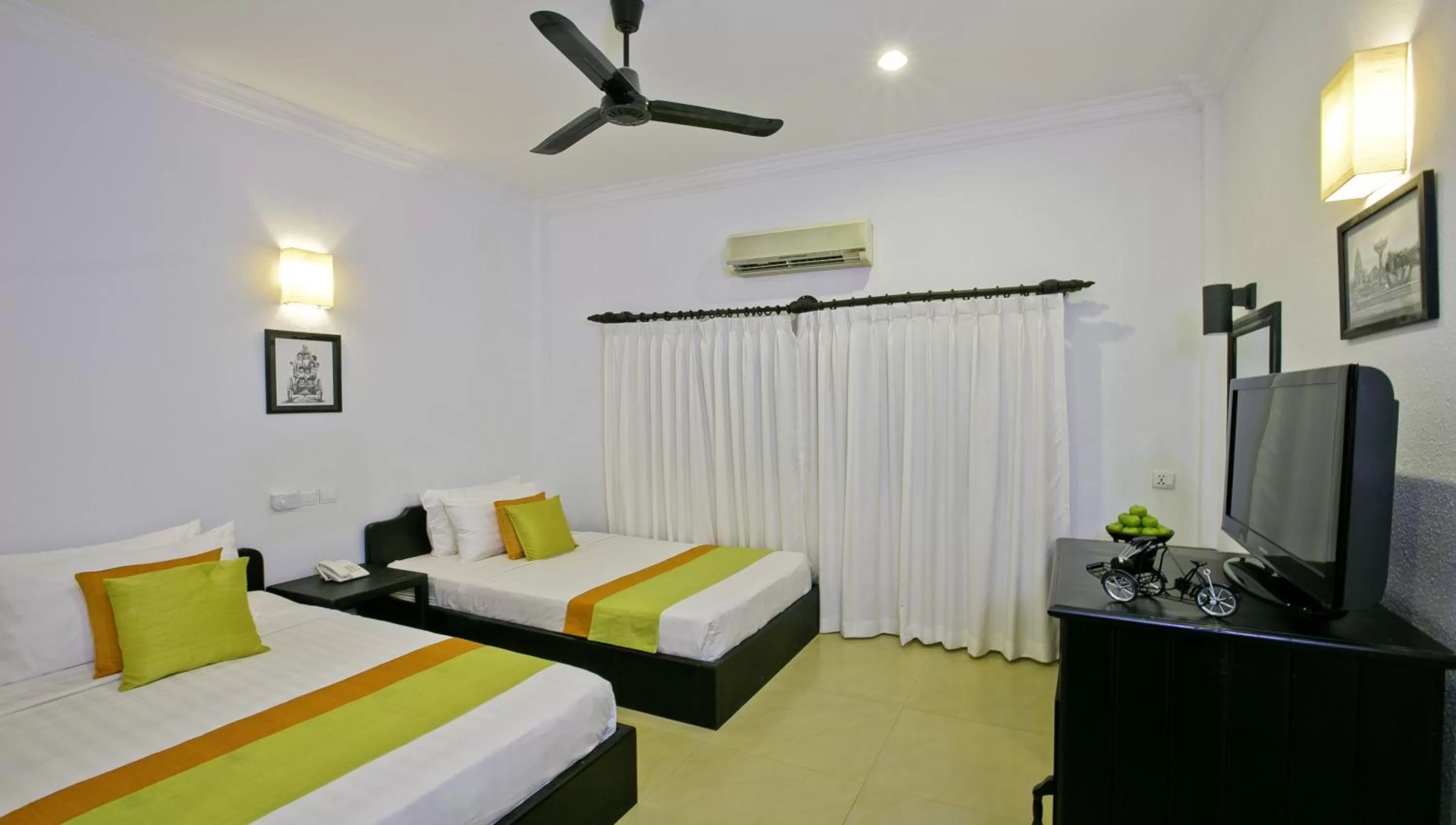 Photo of the whole room, Bed in The Cyclo d'Angkor Boutique Hotel