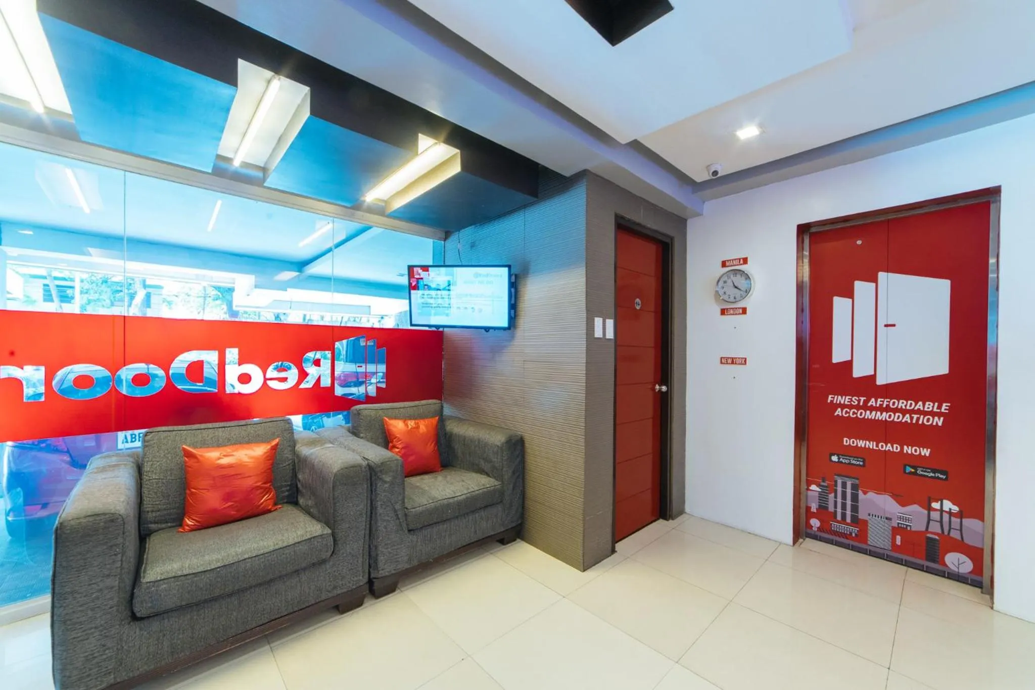 Seating area in RedDoorz Plus at One Liberty Hotel Kalayaan Avenue