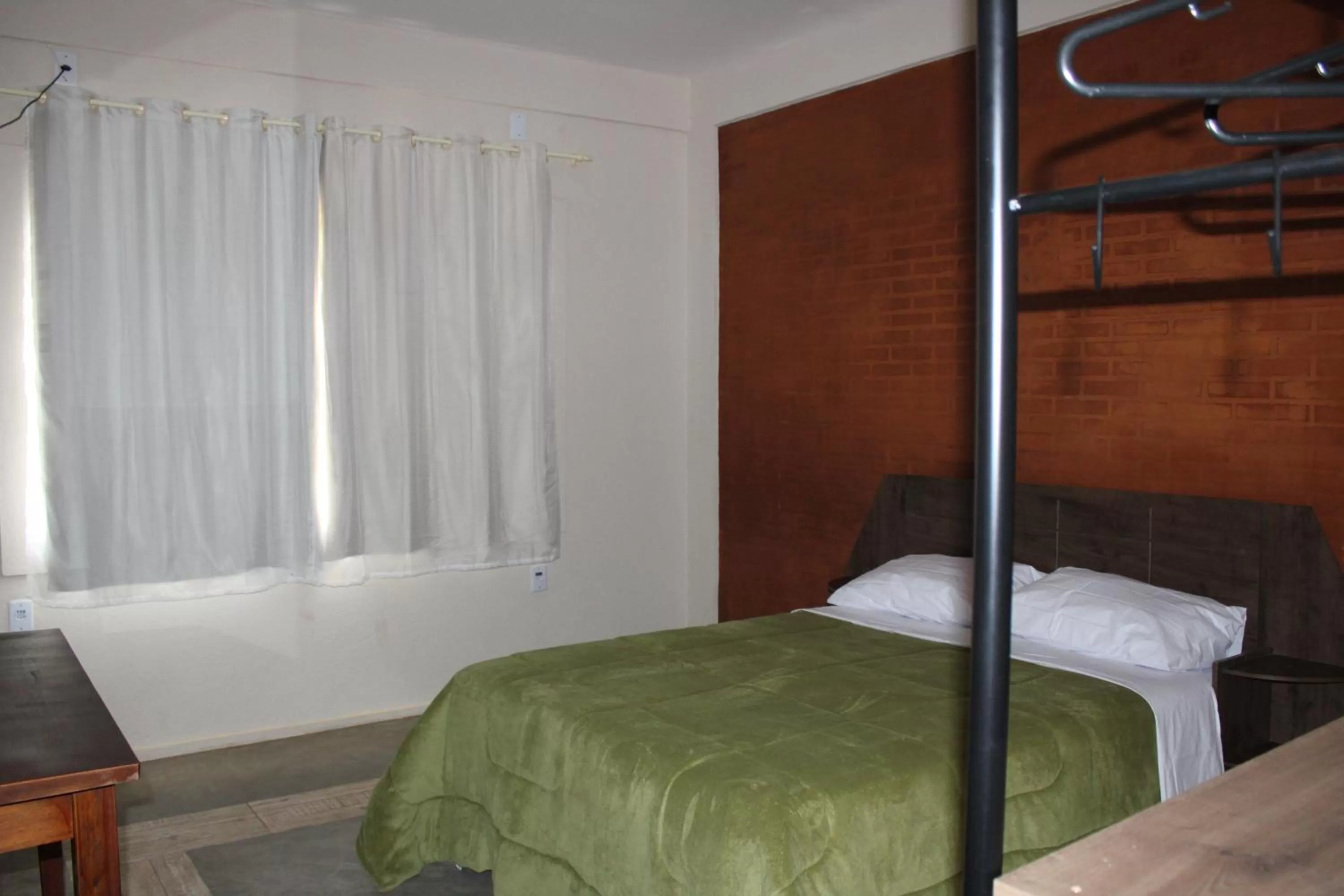 Bed in Pousada Morro dos Ventos