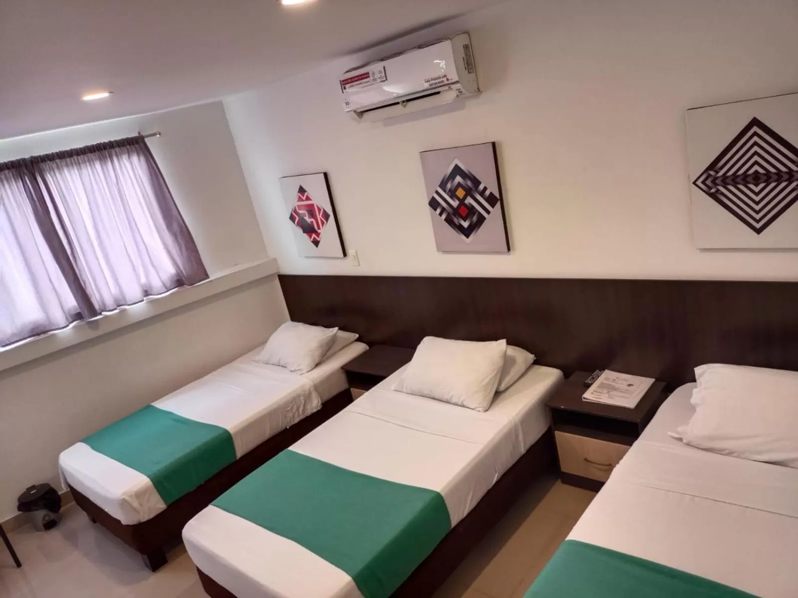 Bed in Apartasuites San Marcos