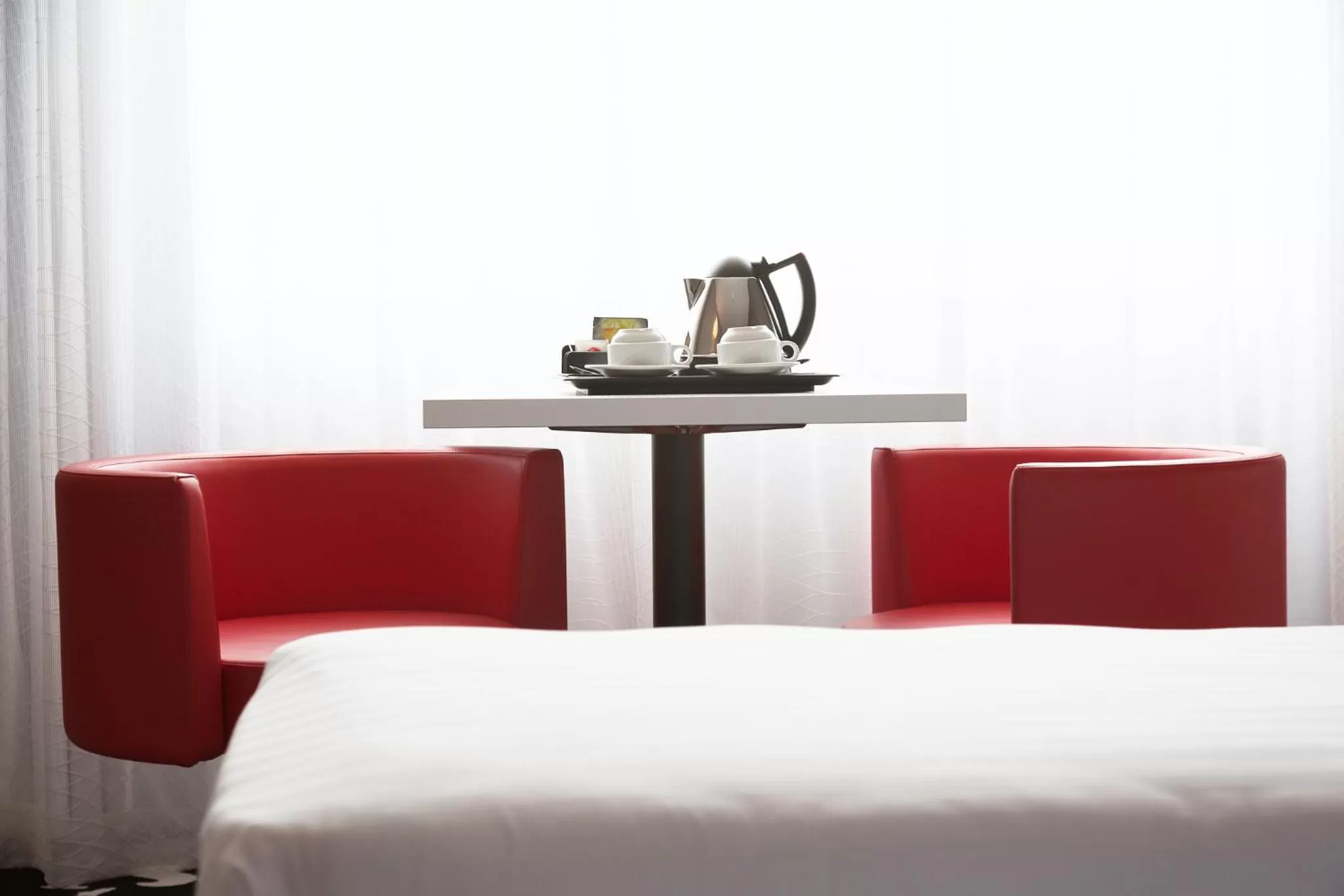 Seating area, Bed in Hotel Tristar