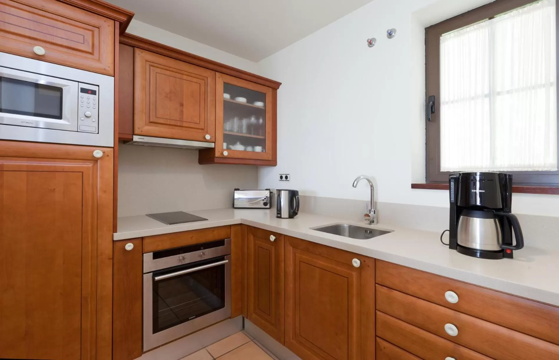 Kitchen or kitchenette in Hotel Suite Villa Maria