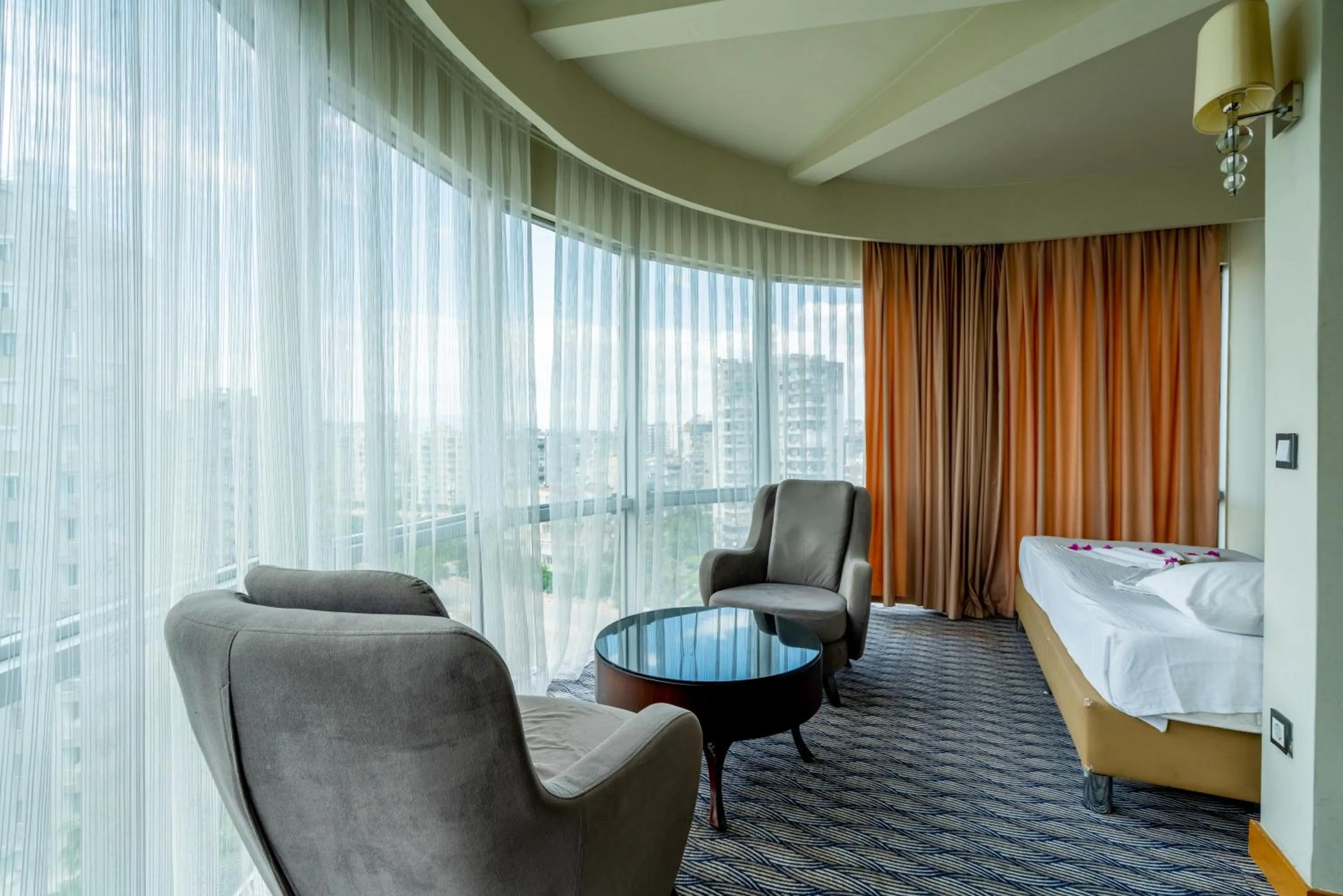 Seating area, Bed in City Live Hotel