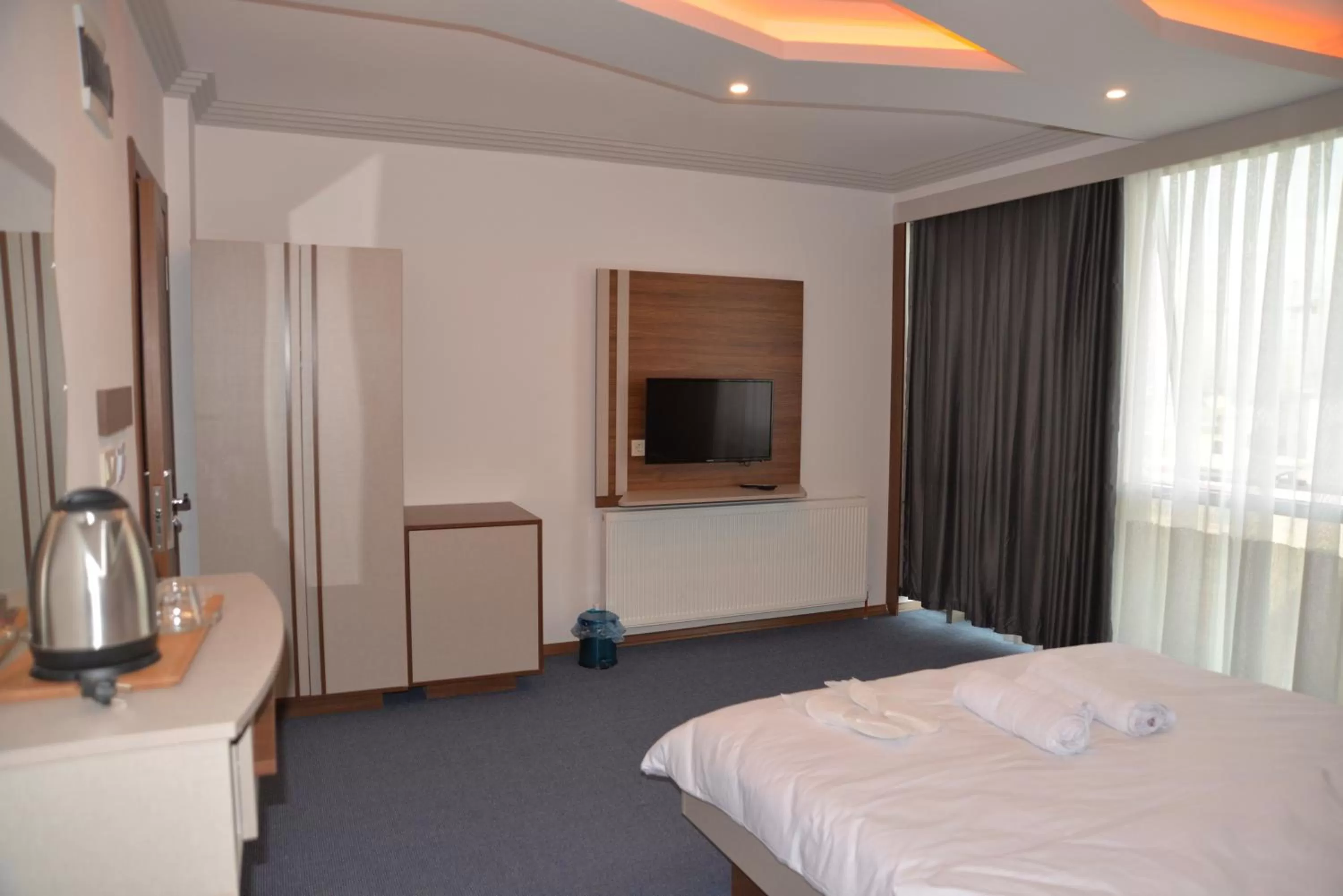 Bed in TEVETOGLU HOTEL