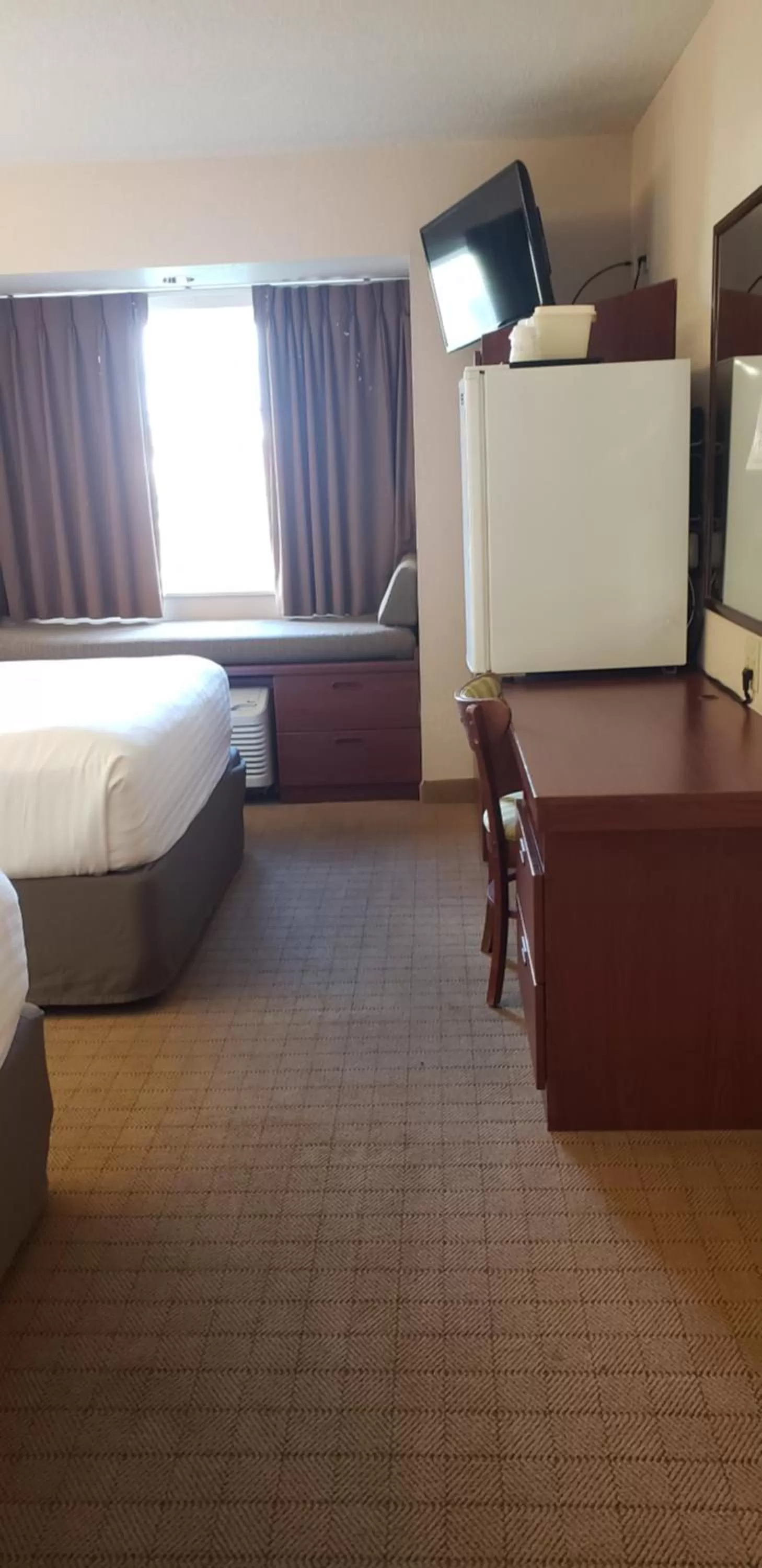 Bed in Microtel Inn & Suites by Wyndham Wellsville