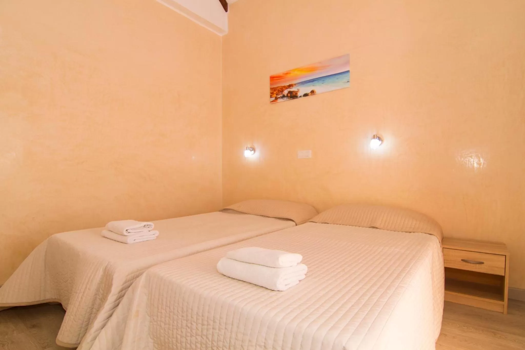 Bed in Yucca Park ApartHotel