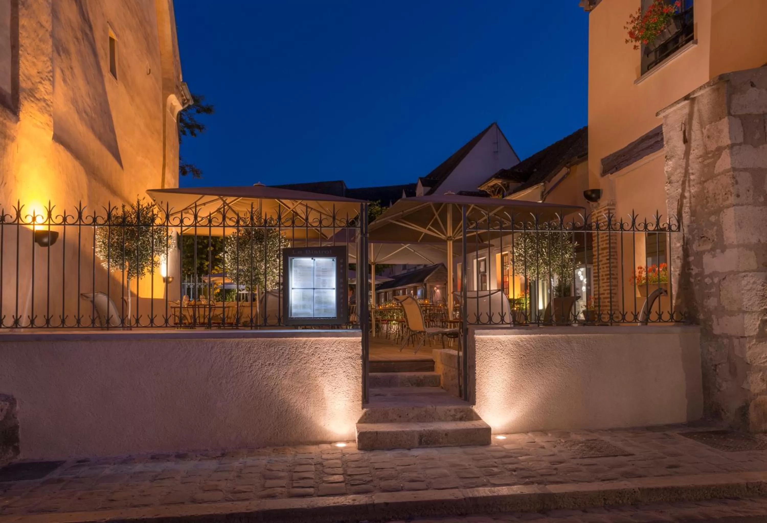 Patio in Hôtel Aux Vieux Remparts, The Originals Relais