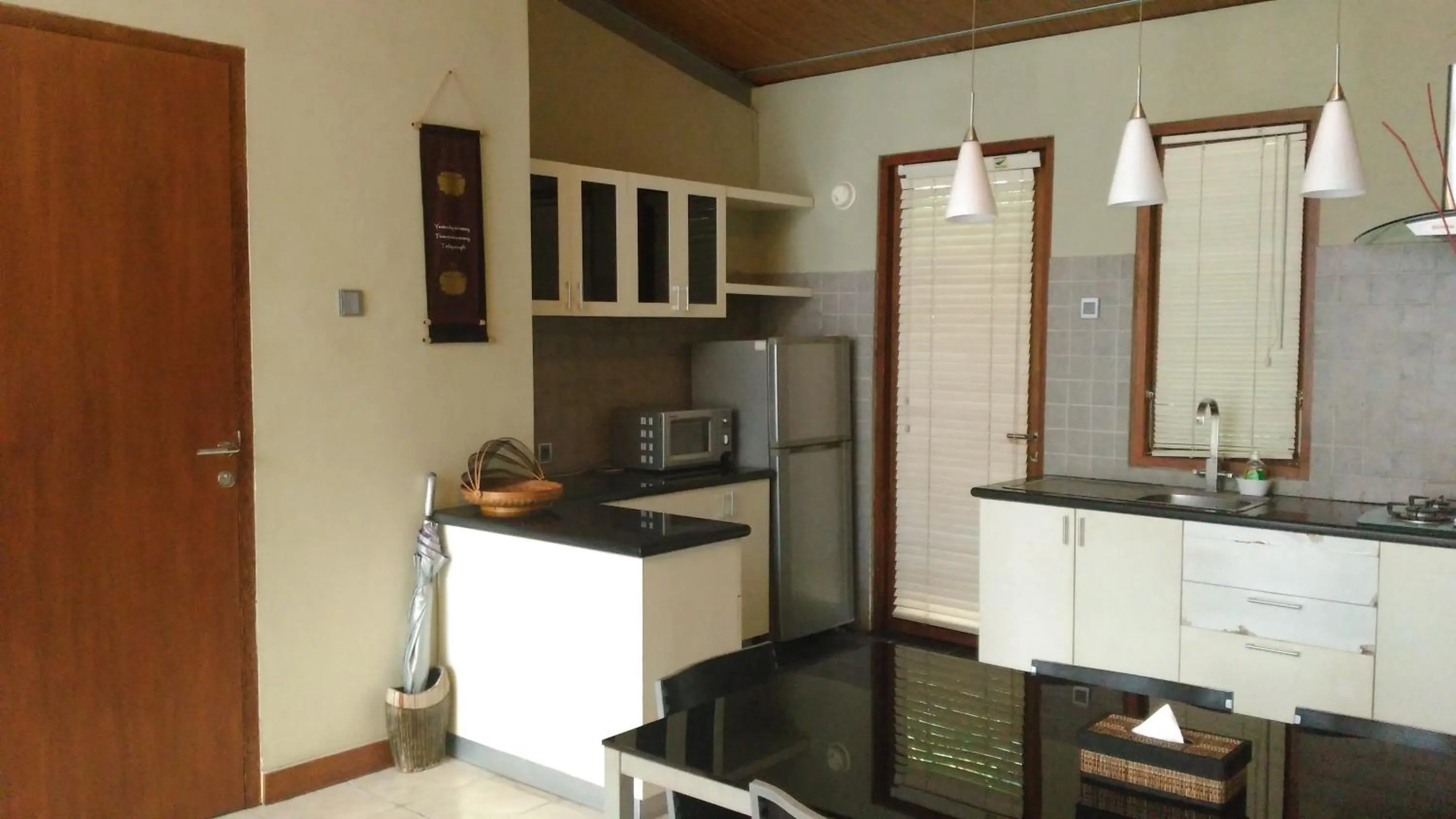 Kitchen or kitchenette in Villa Puri Ayu