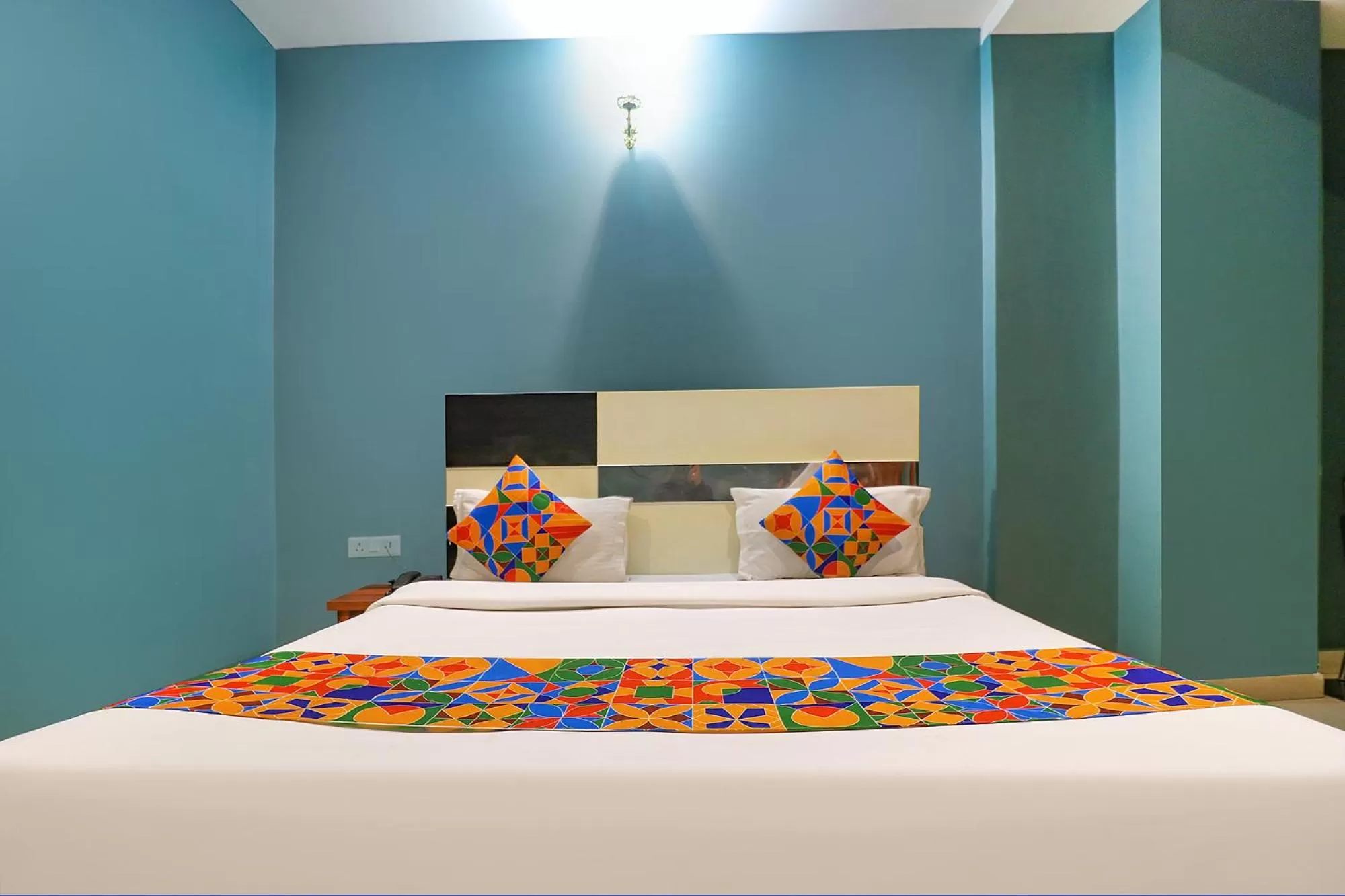 Bed in FabHotel Maxx Inn