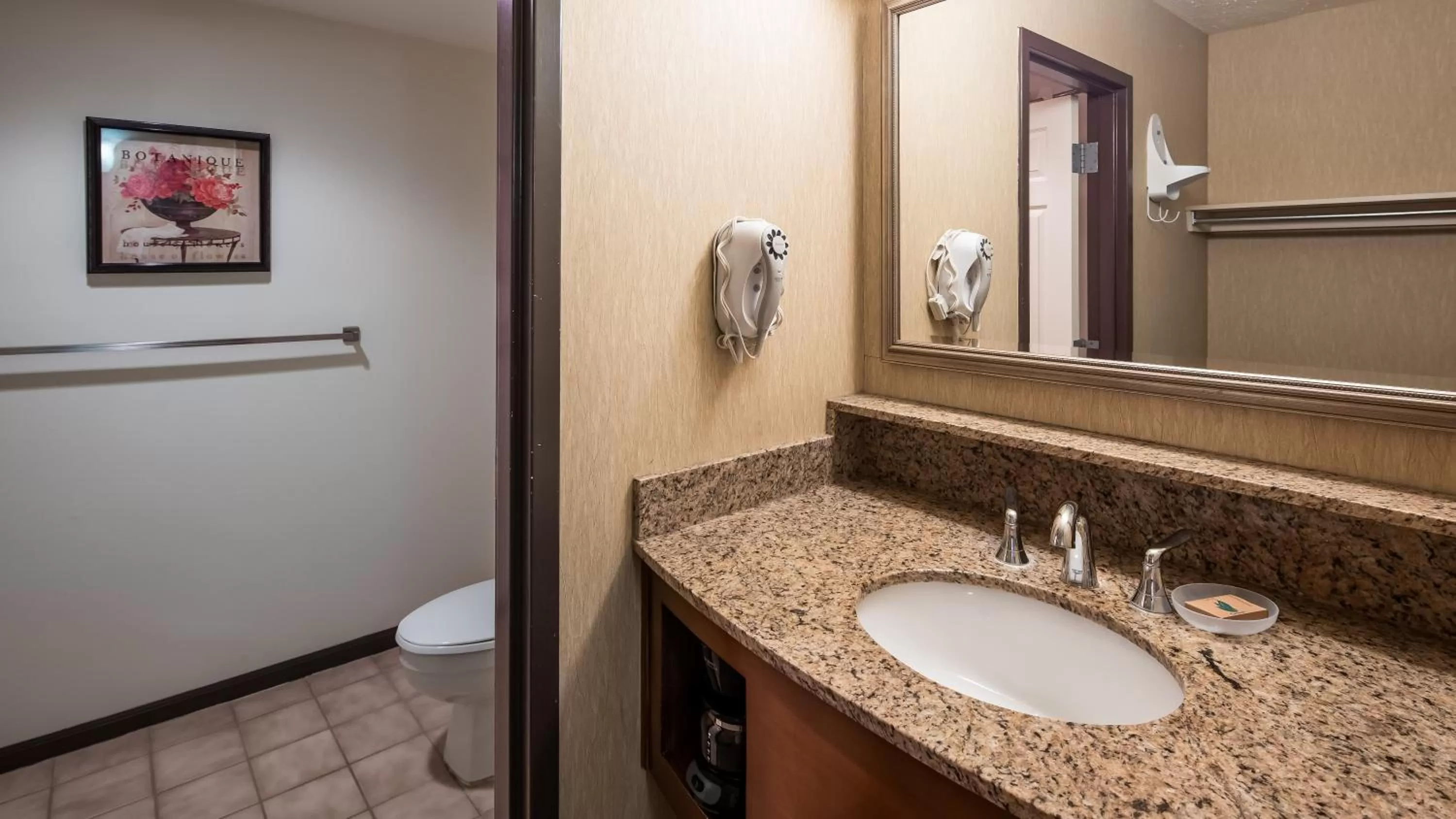 Bathroom in Apple Tree Inn; SureStay Collection by Best Western