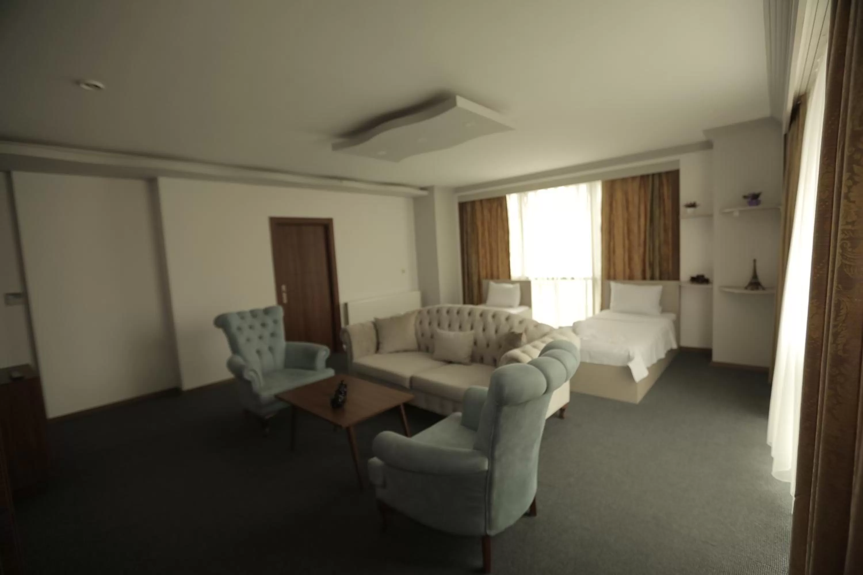 Bed in TEVETOGLU HOTEL