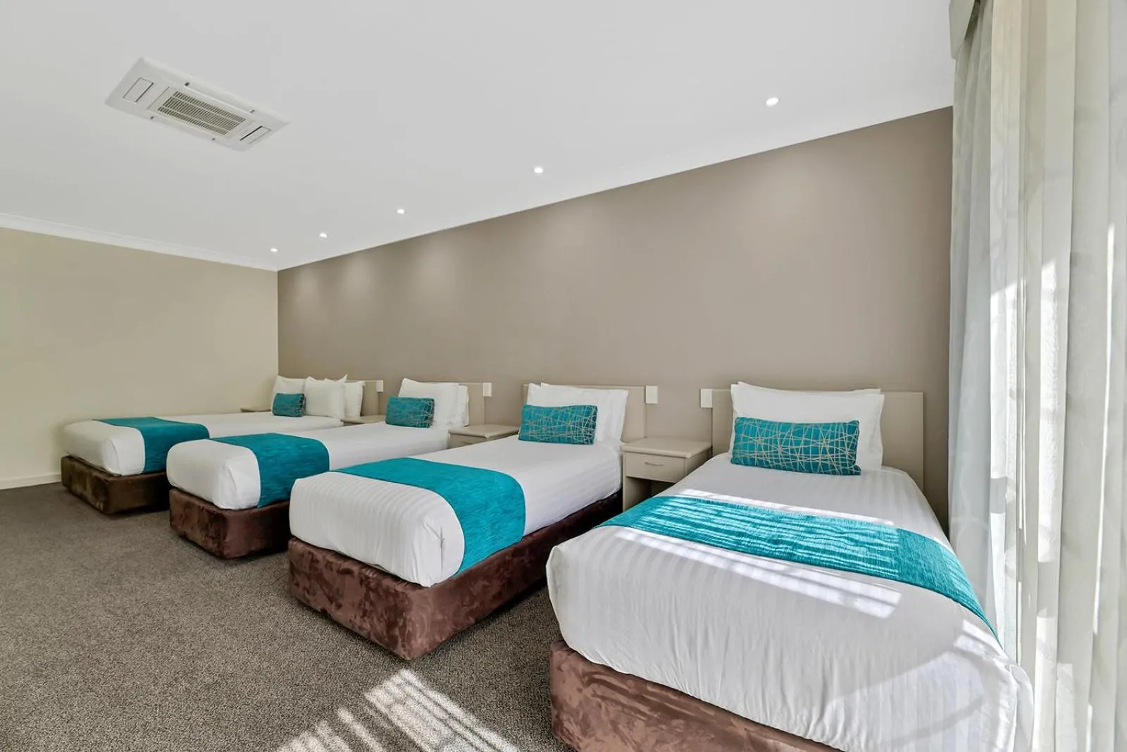 Bed in Central Caleula Motor Lodge