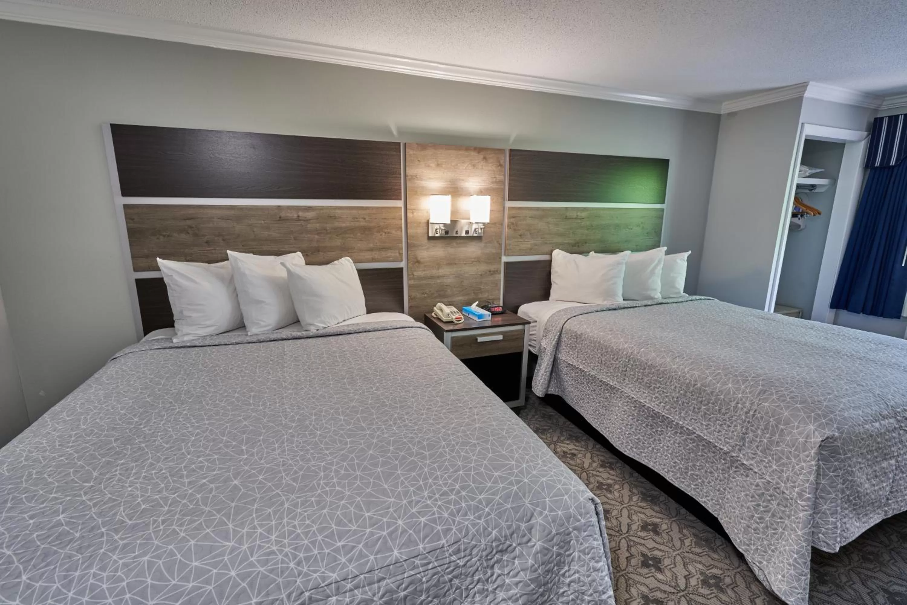 Bed in Ambassador Inn and Suites