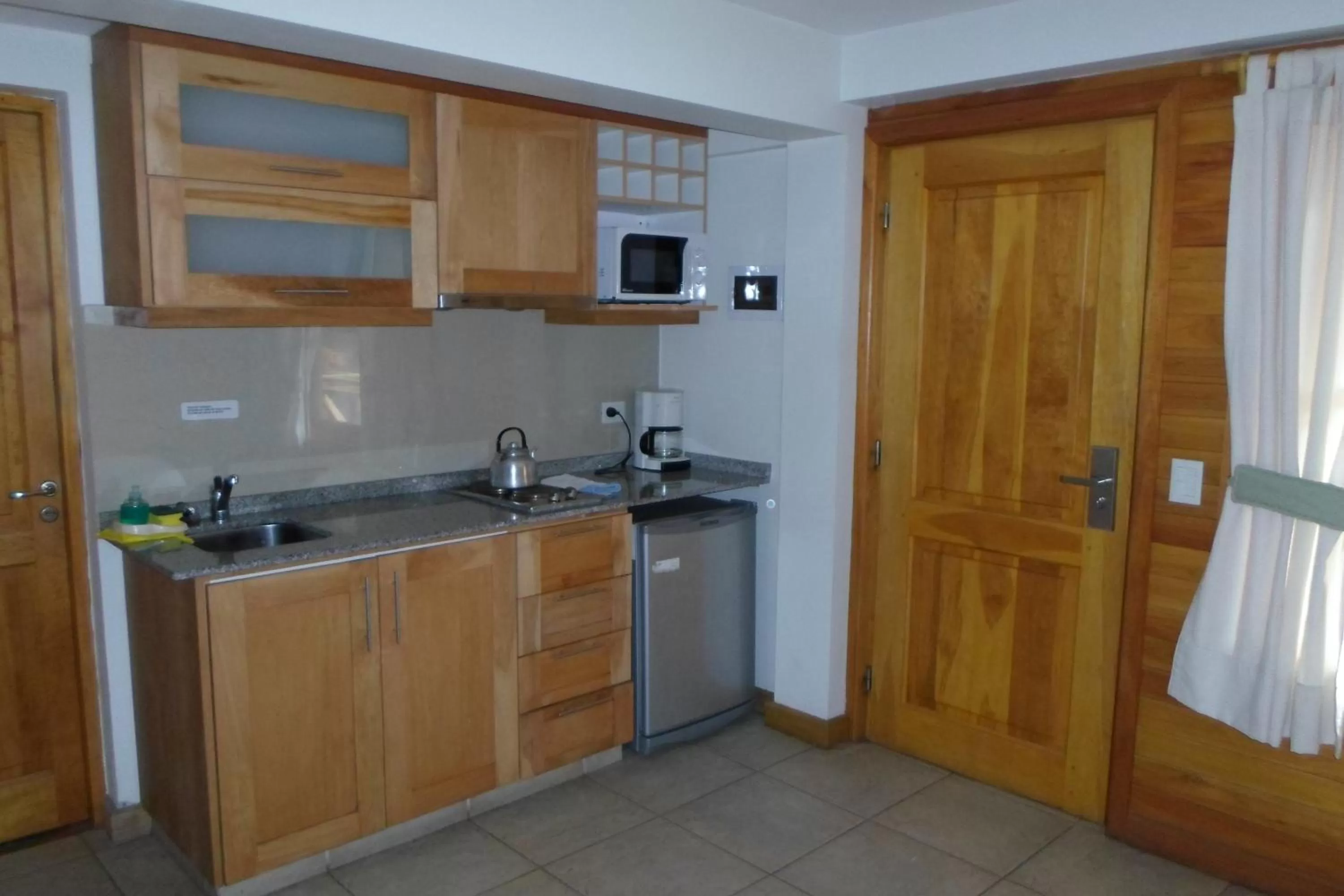Kitchen or kitchenette in Apart Hotel Robles del Sur