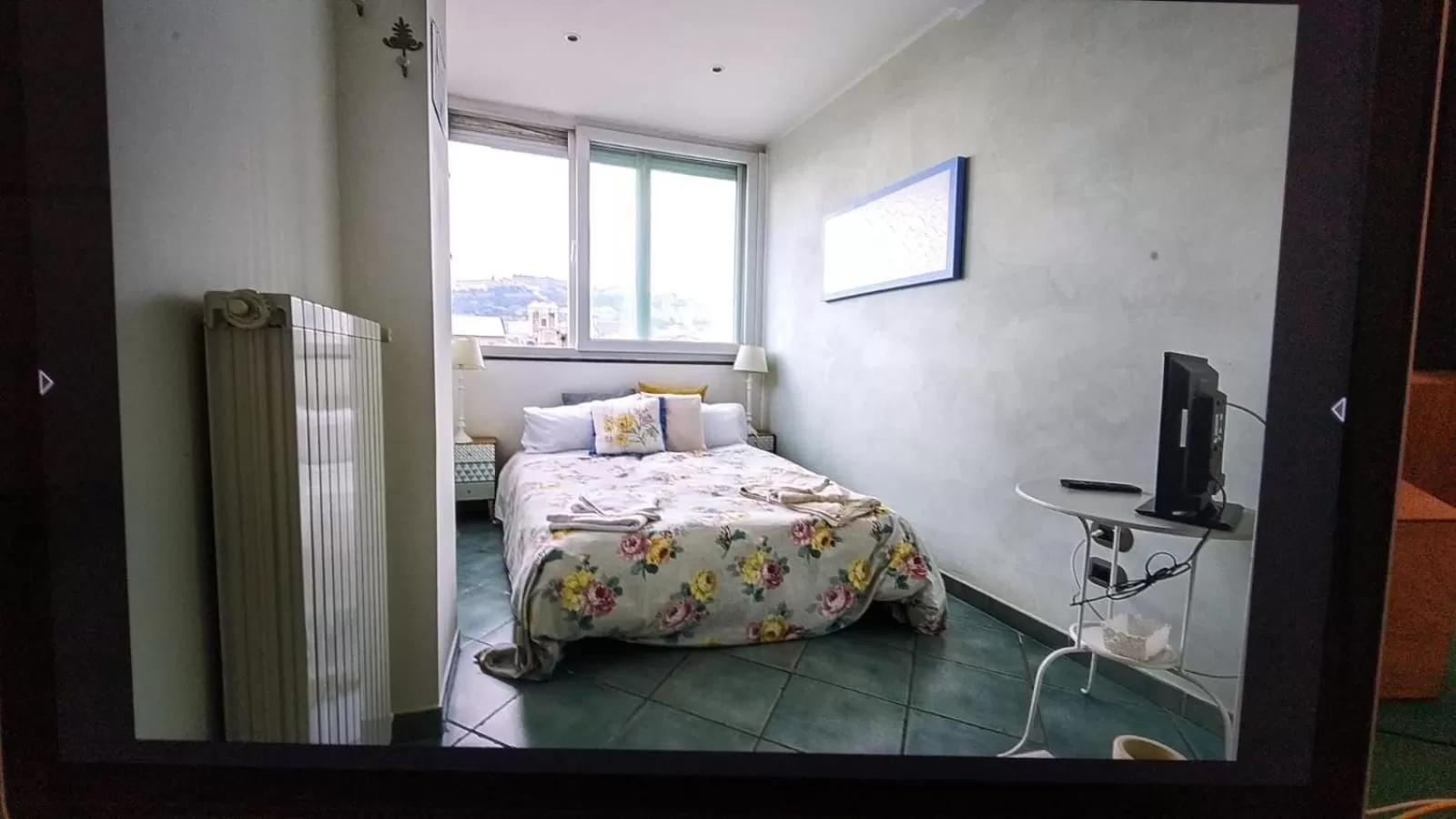 Photo of the whole room, Bed in La Casa sui Tetti