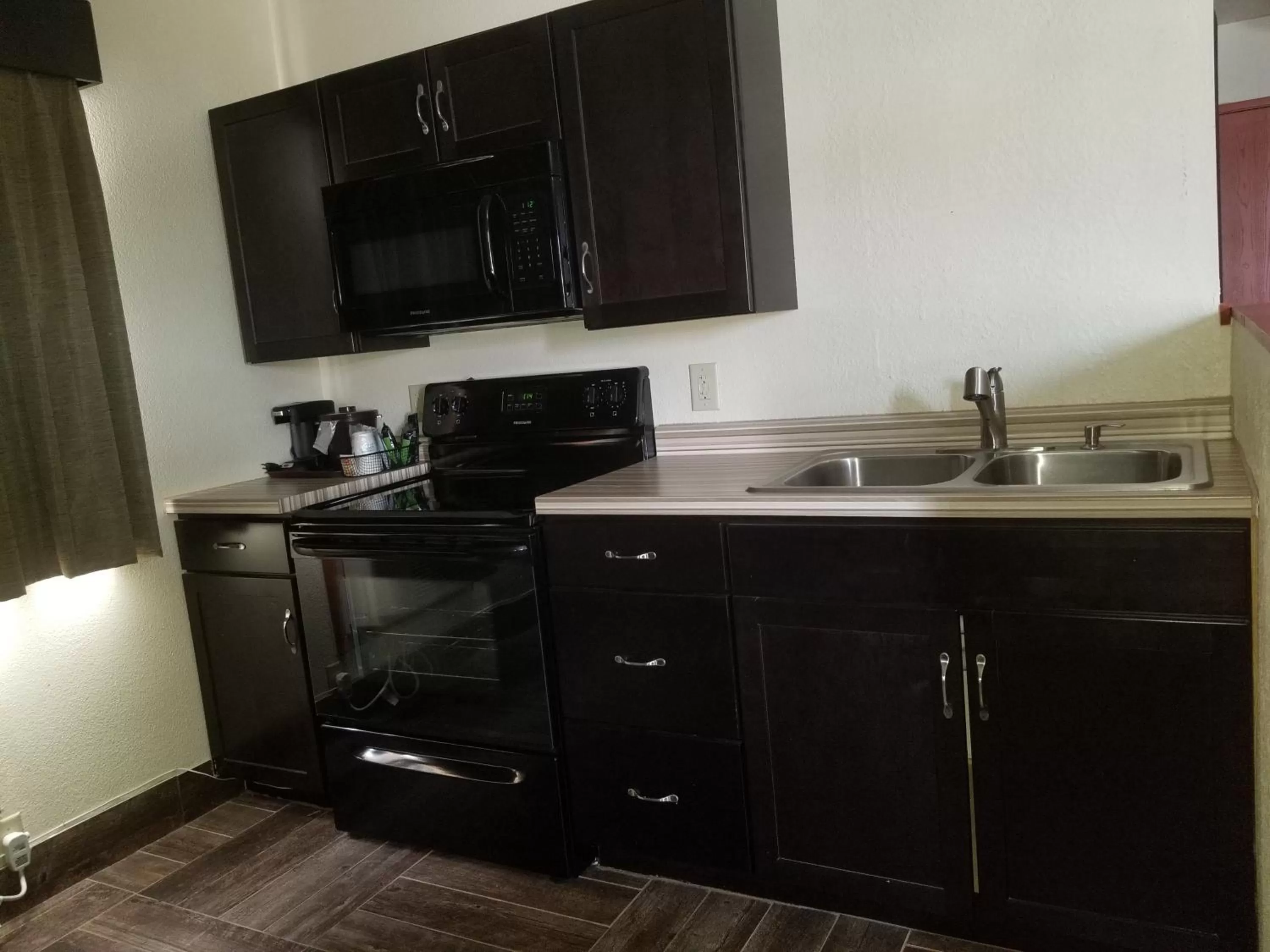 Kitchen or kitchenette in Baymont by Wyndham Eau Claire WI