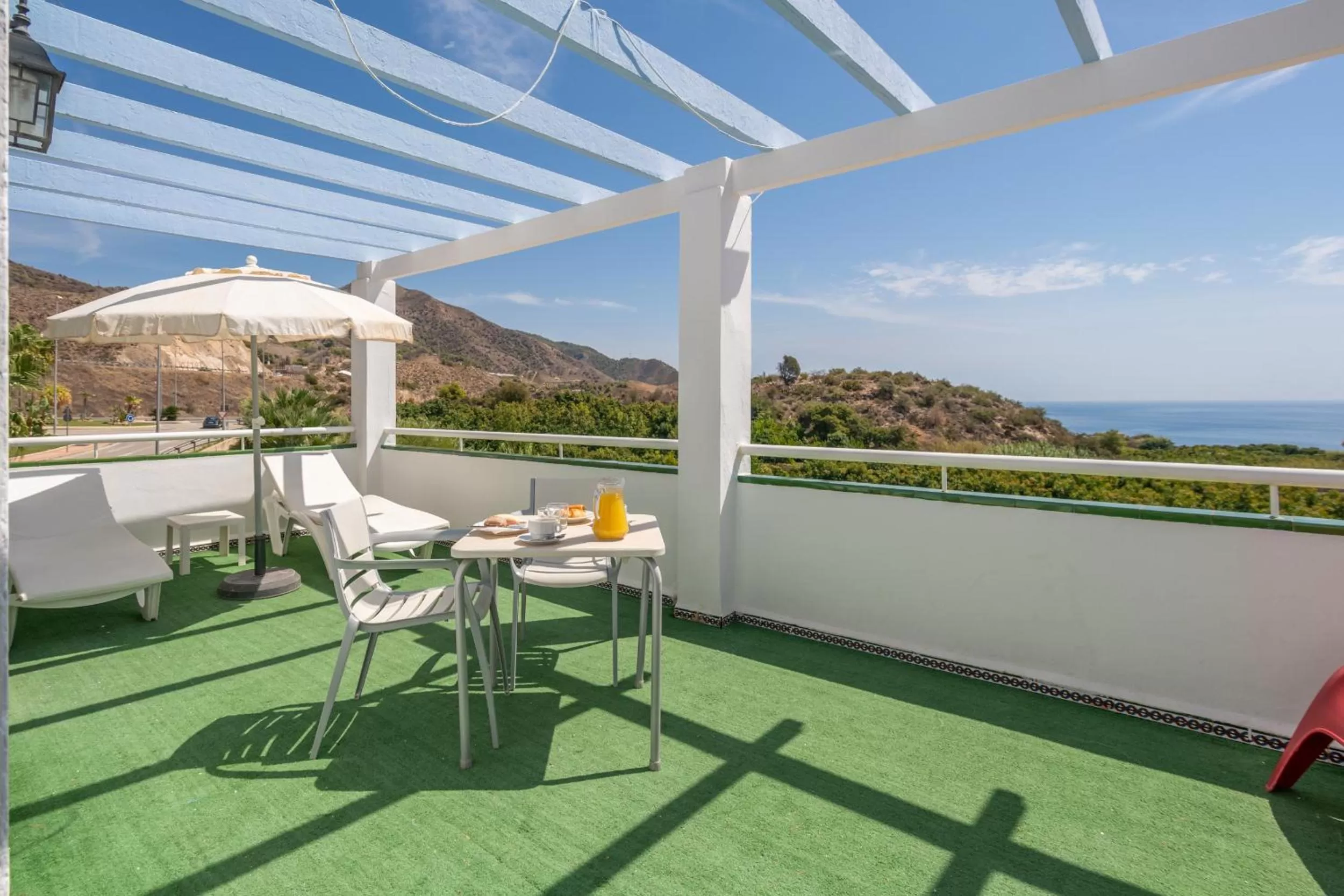Balcony/Terrace in Apartahotel Playamaro by Dorobe