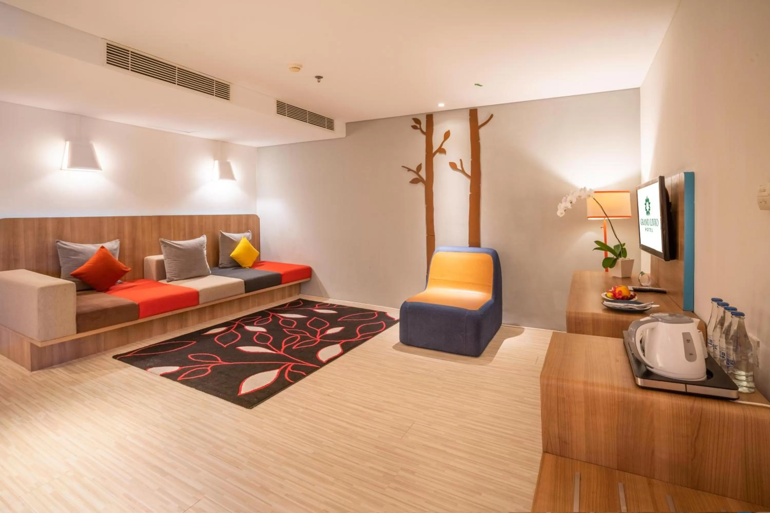 Living room, Bed in Grand Livio Kuta Hotel