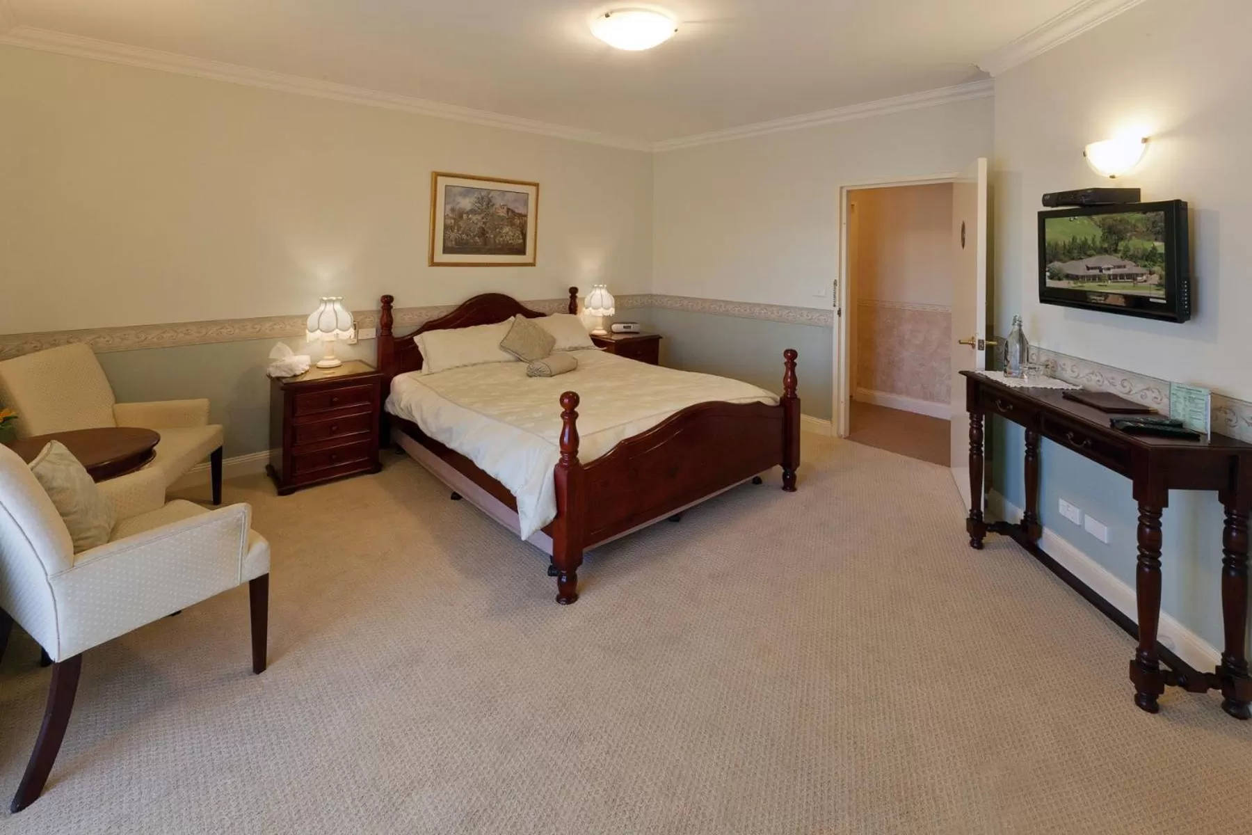 Bed in Plumes Boutique Bed & Breakfast