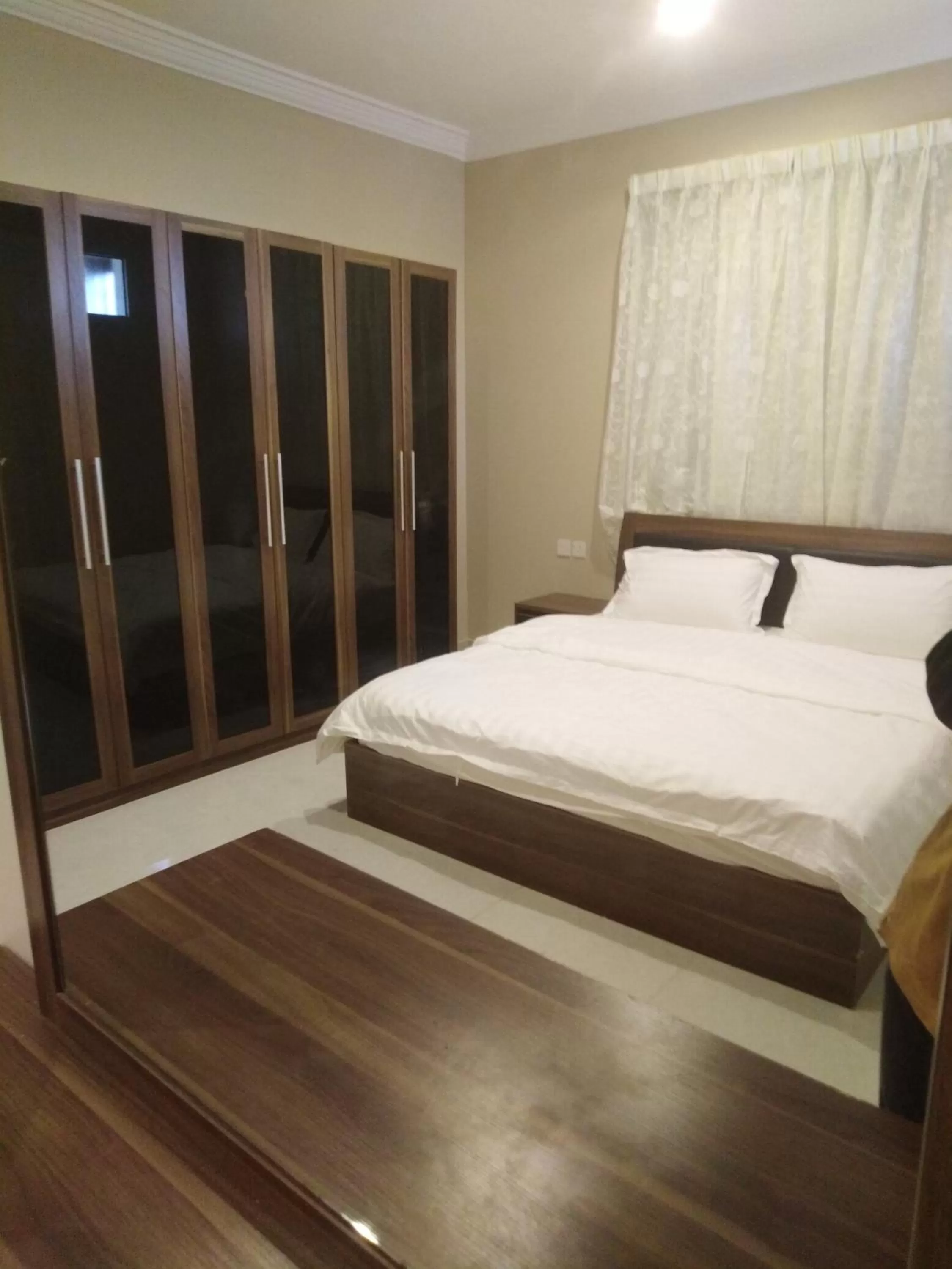 Bed in Sunrise Furnished Apartment