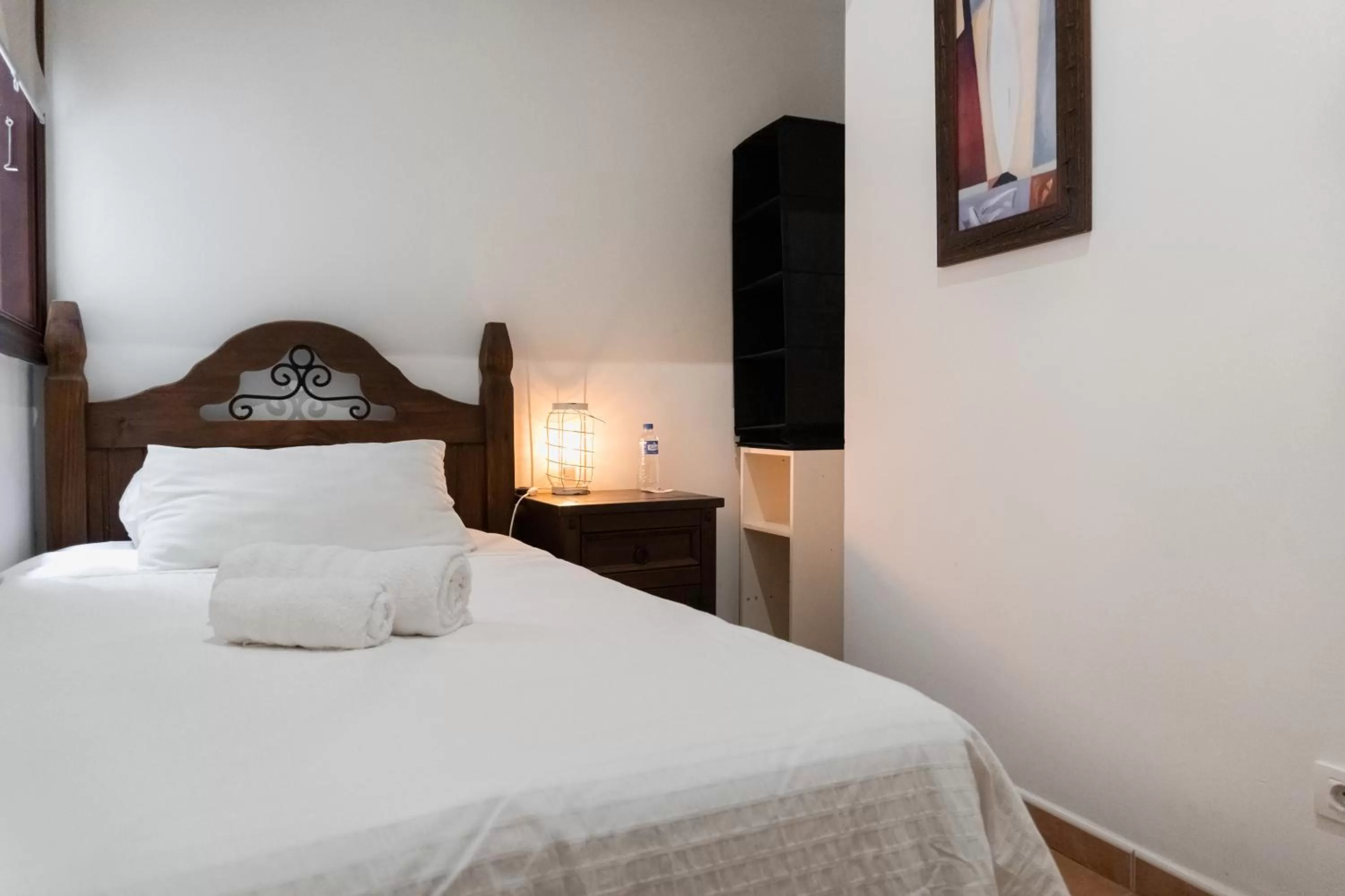 Bed in Santa Ana Suite & Rooms