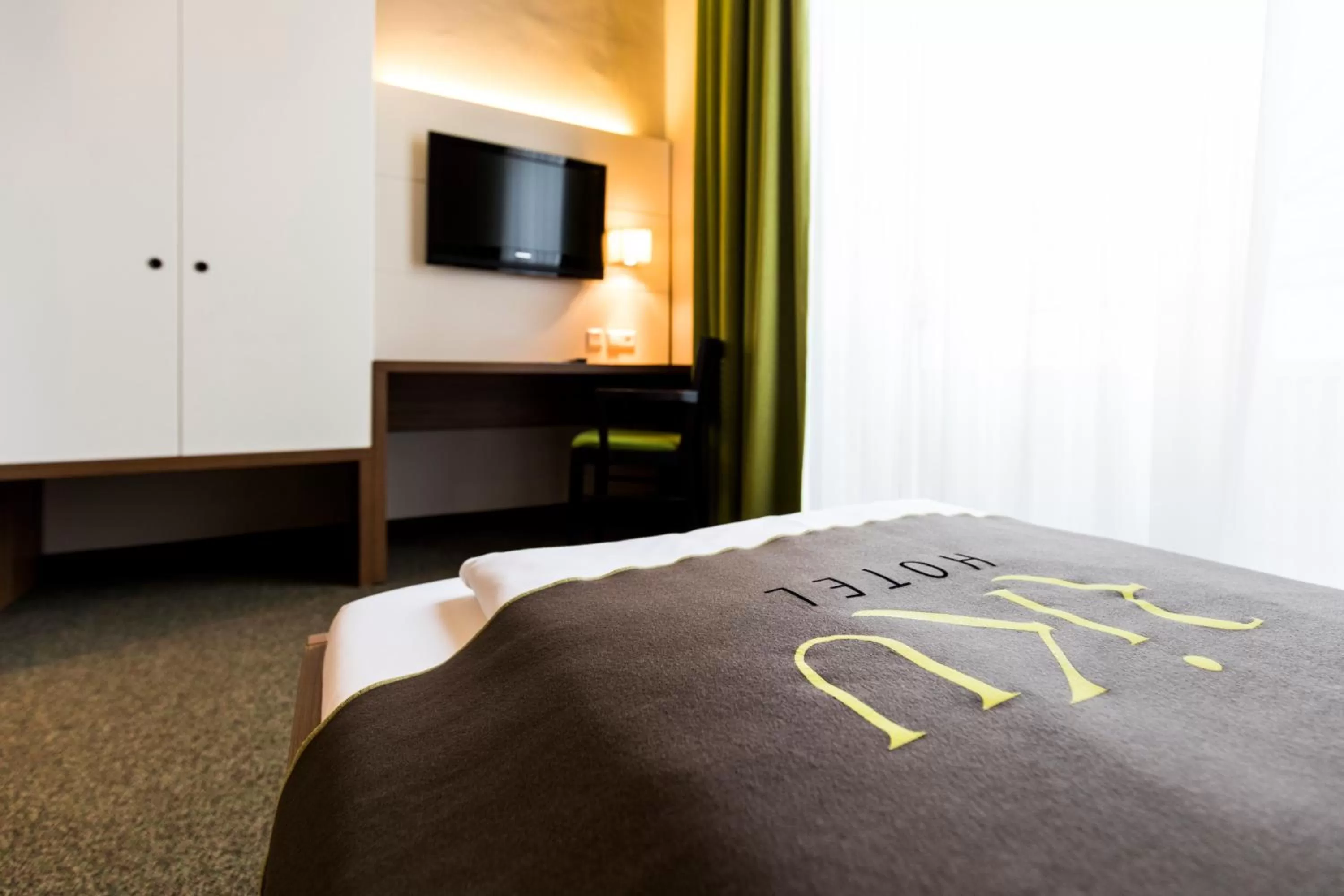 Photo of the whole room, Bed in RiKu HOTEL Neu-Ulm