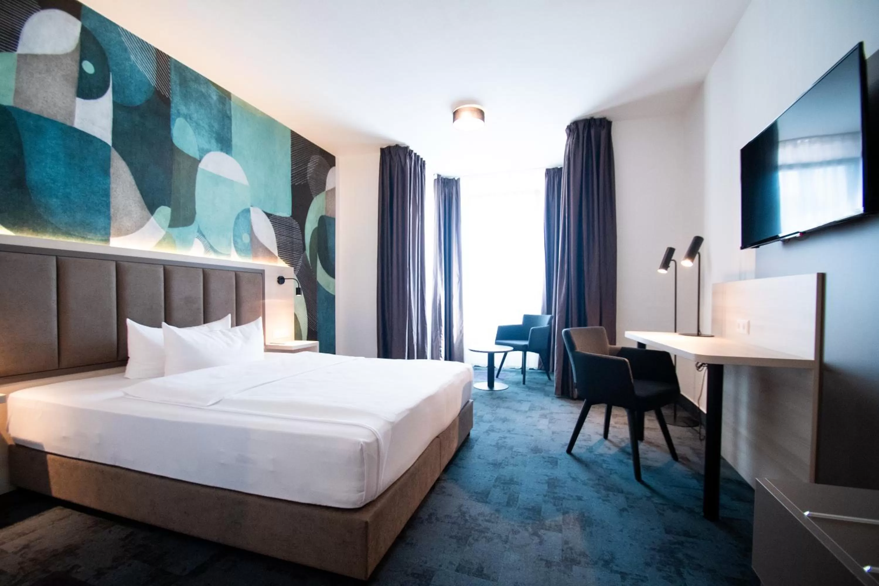 Photo of the whole room, Bed in Taste Hotel Kulmbach