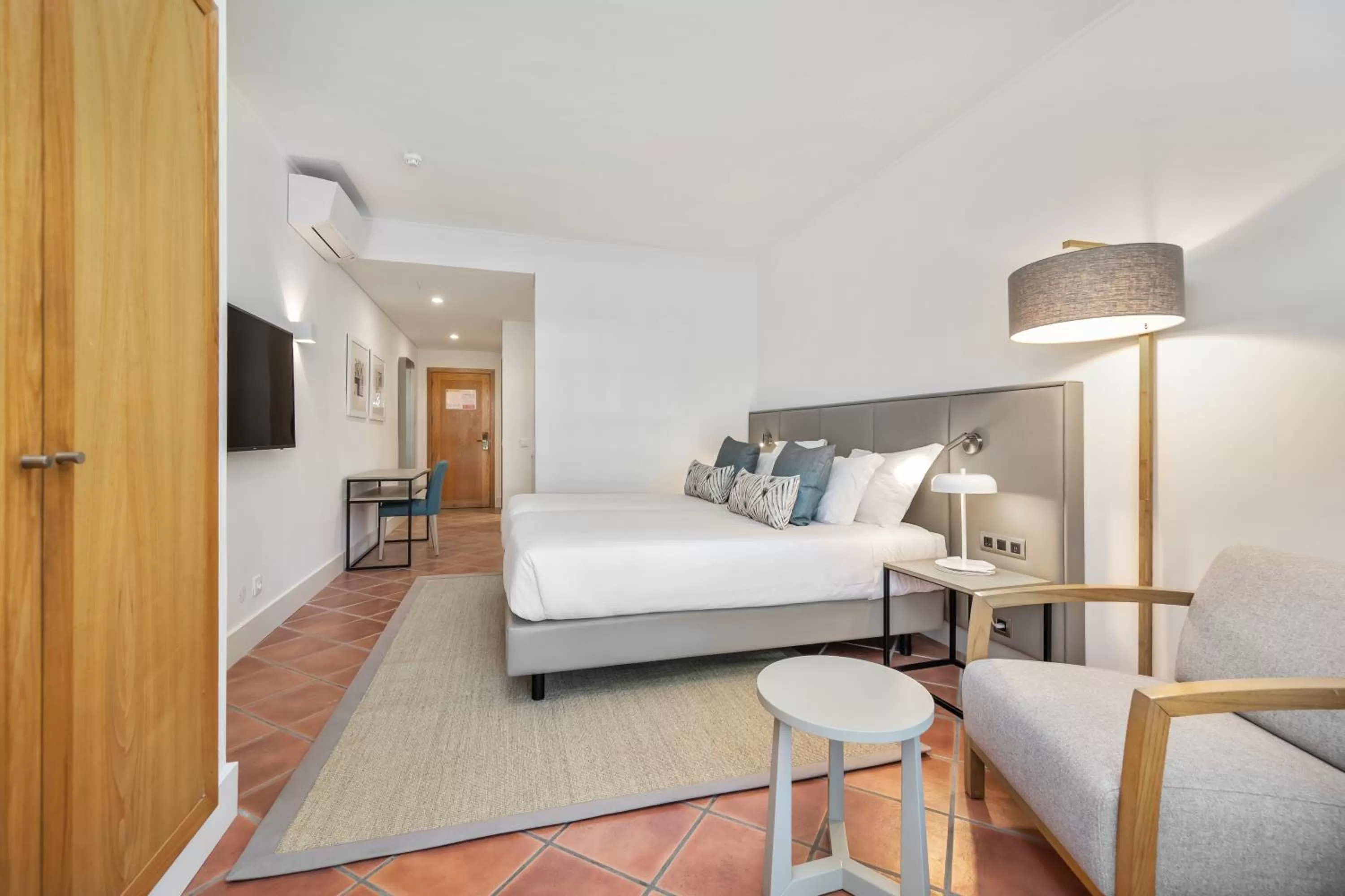 Bed in The Patio Suite Hotel