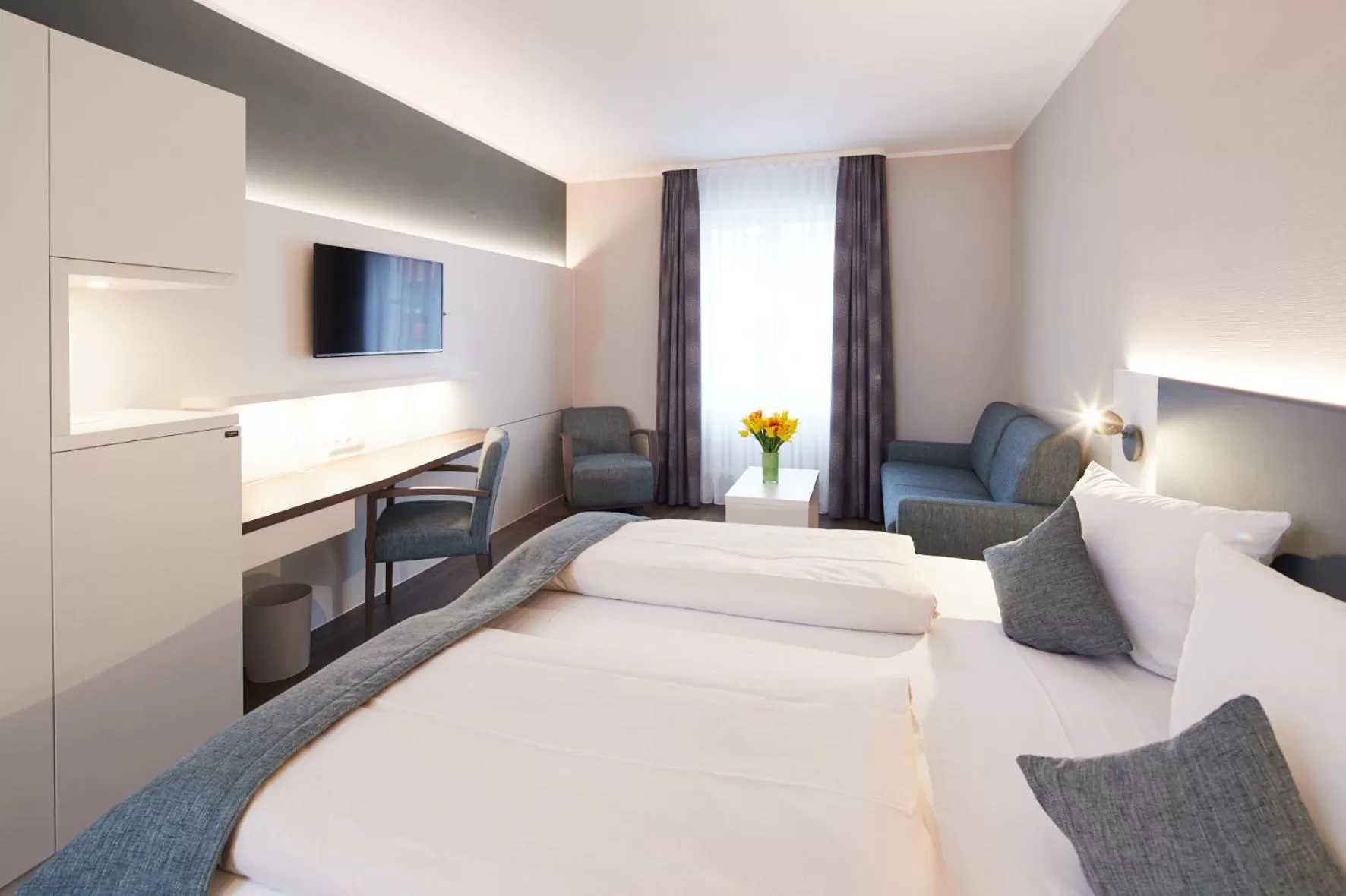 Photo of the whole room, Bed in Stadthotel Freiburg Kolping Hotels & Resorts