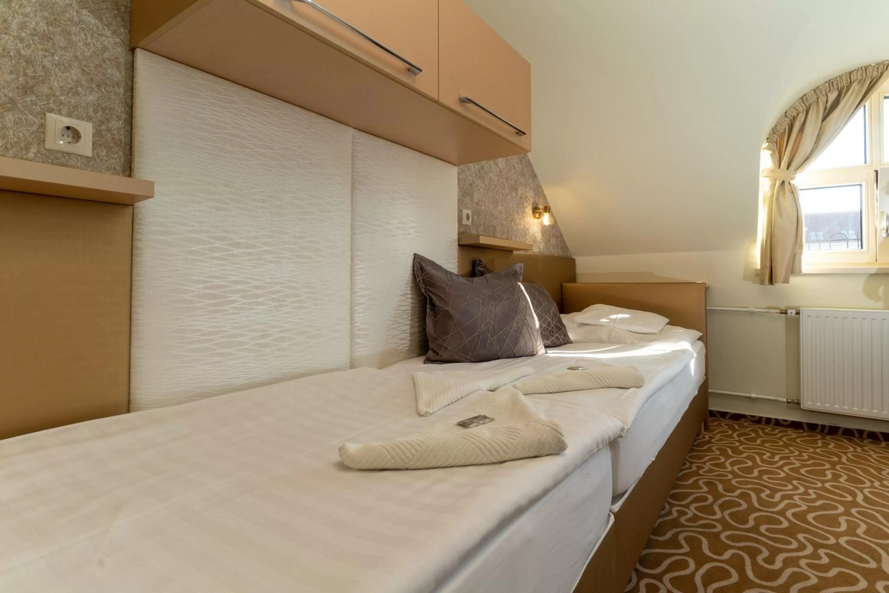 Bed in Teátrum Boutique Hotel