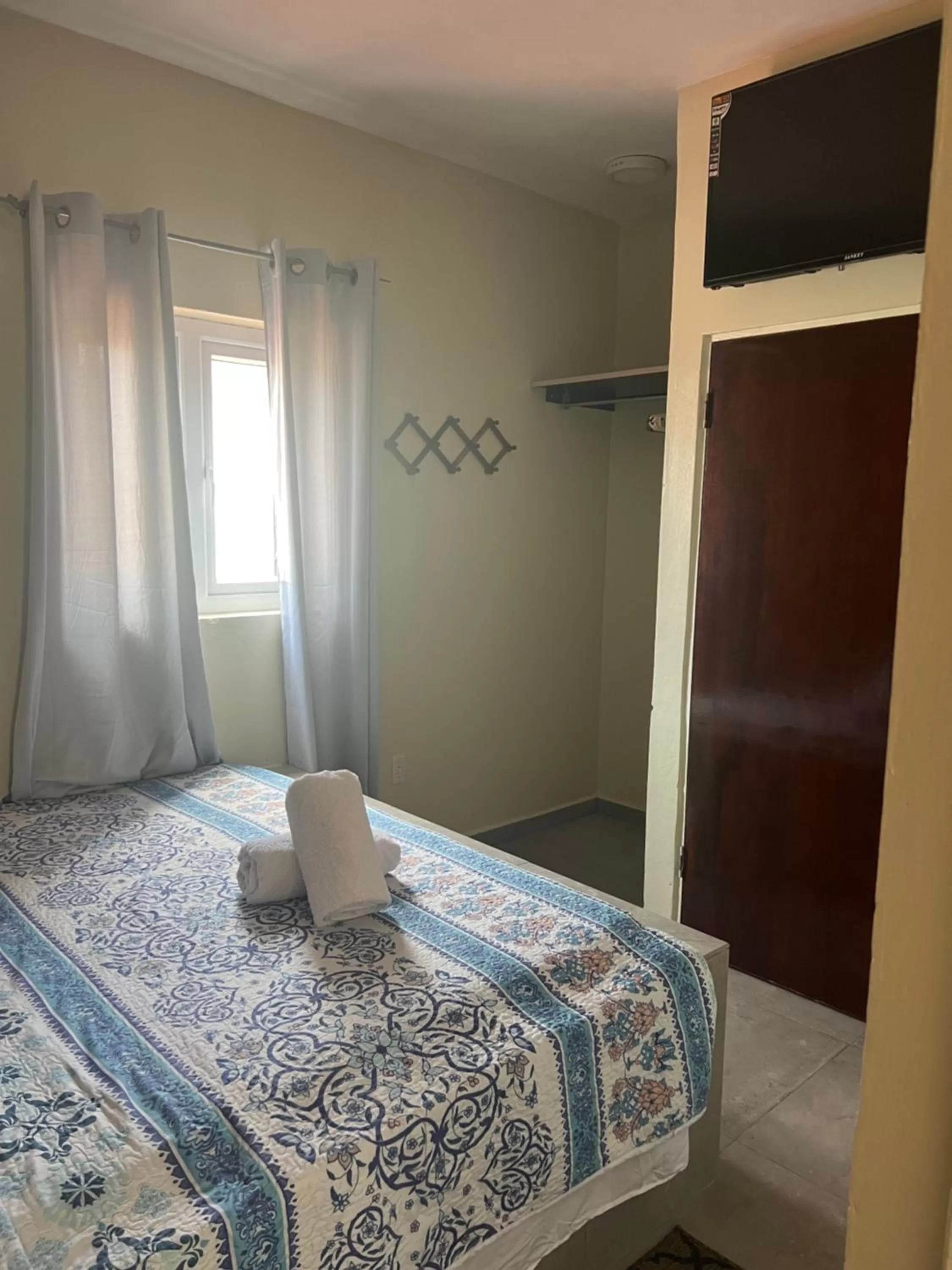 Bed in Curasita colour Appartments