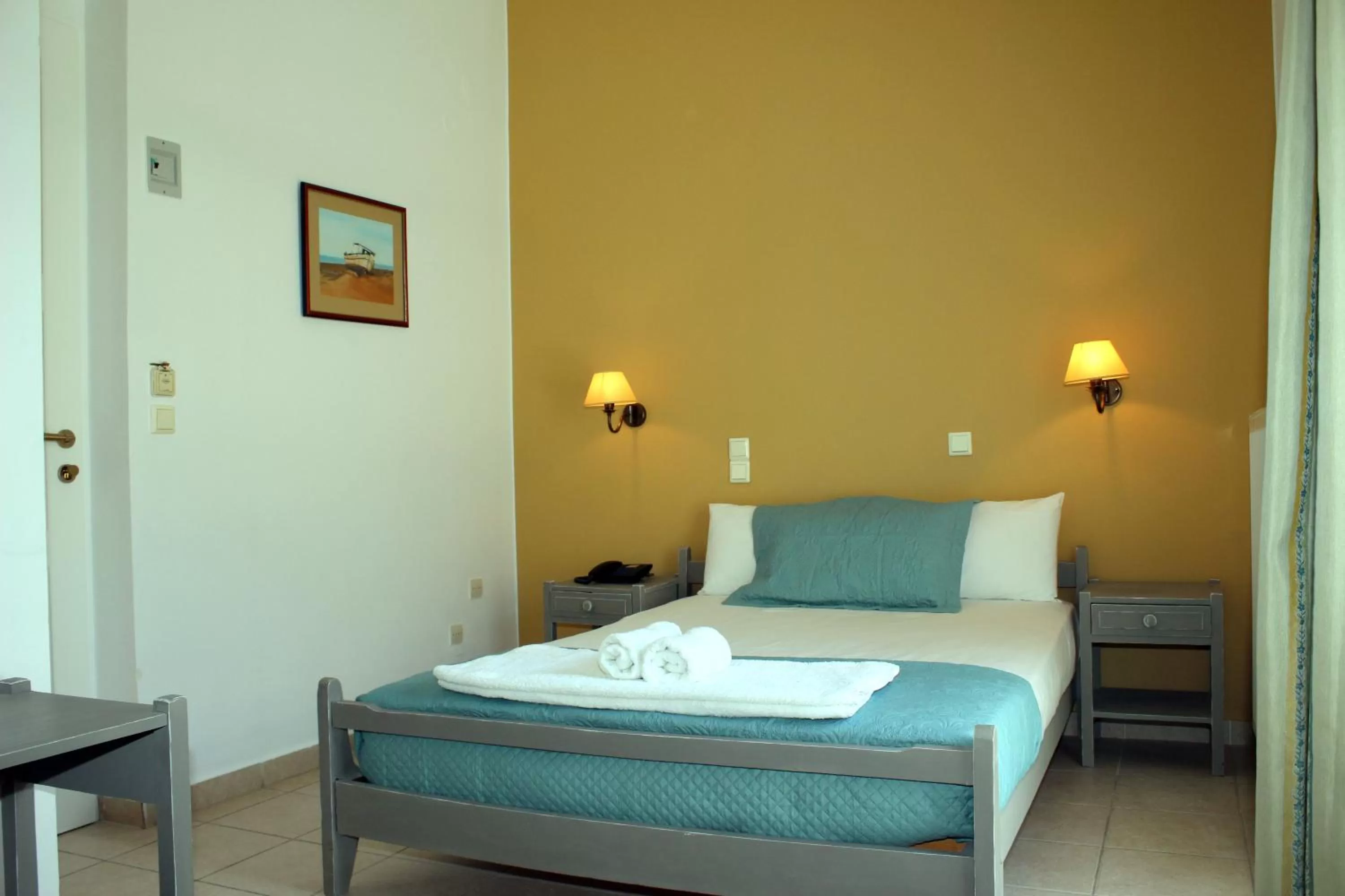 Bed in Ikaros Art Hotel